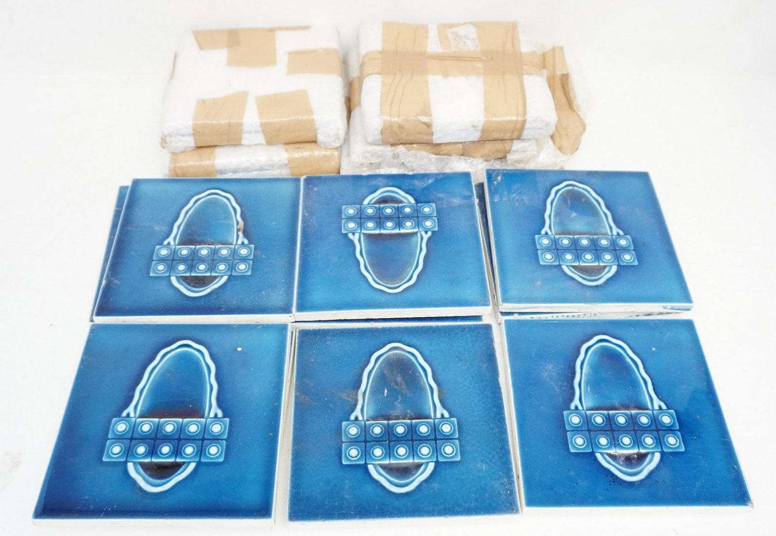 19 ART DECO POTTERY TILE: 19 Blue Art Deco Pottery Tiles c. 1920-30s. Each 6"x6". A few with firing flaws, nicks. Weight on all 22 pds. NO IN HOUSE SHIPPING. PROVENANCE: A Private Charleston SC Estate.***Pickup only or Shippin