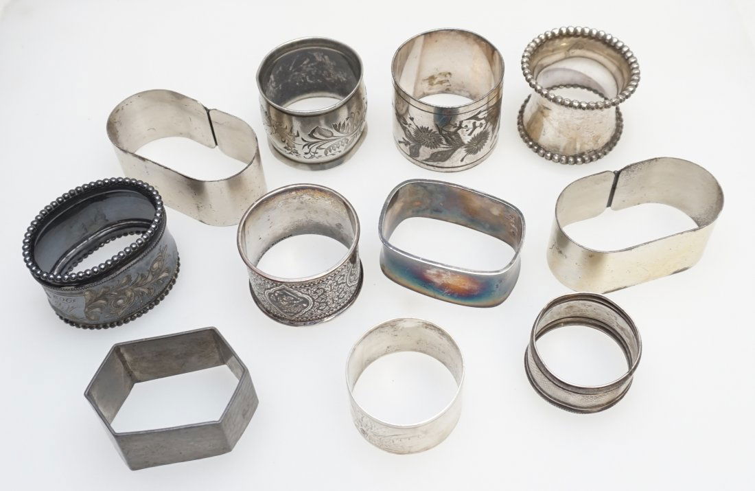 11 ANTIQUE / VINTAGE NAPKIN RINGS: 10 Silverplated Antique and Vintage Napkin Rings and 1 Pewter Napkin Ring. Weight on all 13 oz. PROVENANCE: A Private Charleston SC Estate.