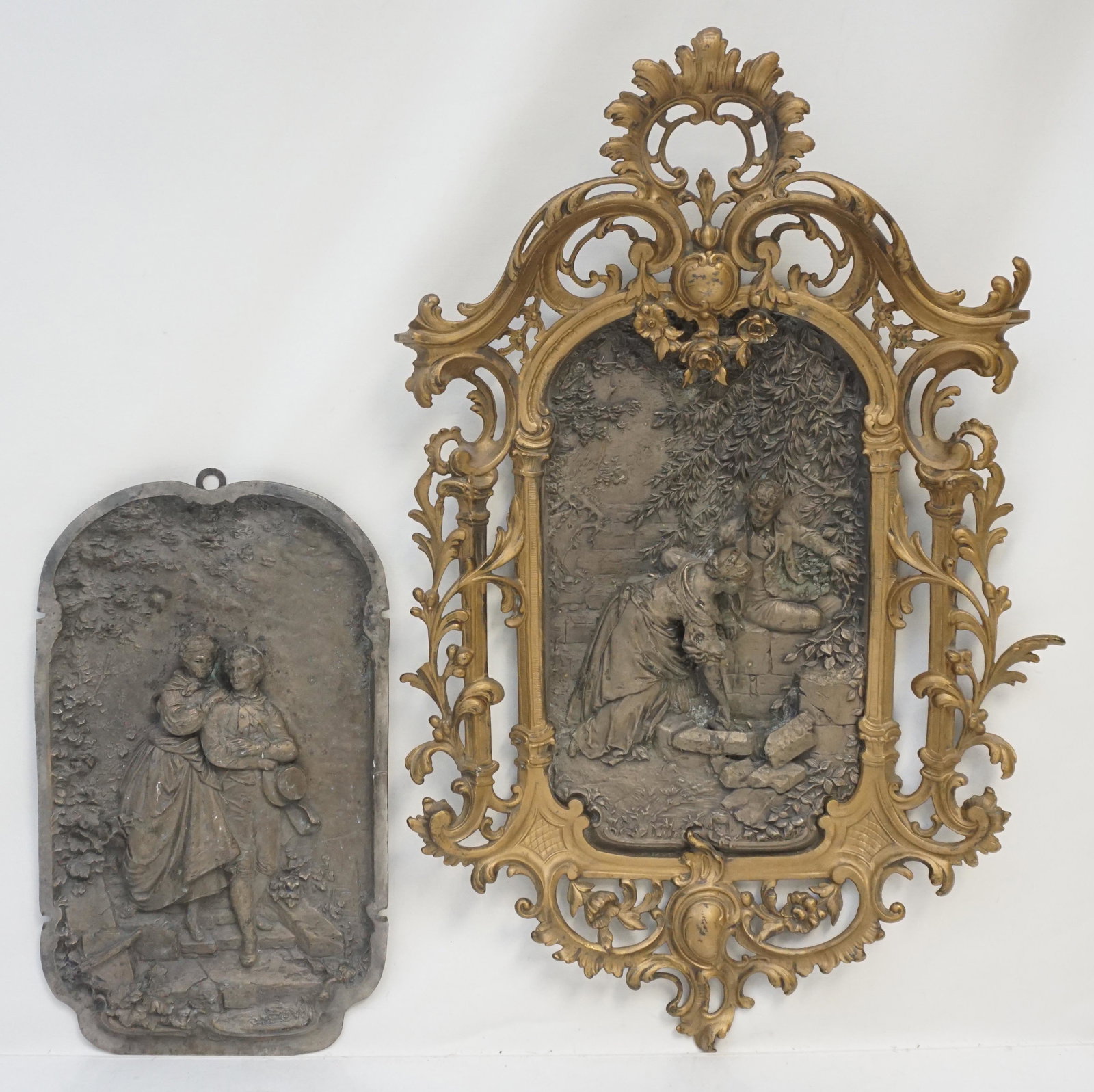 2 BRONZE RELIEF ROMANTIC PLAQUES: Two Antique High Relief Romantic Bronze Plaques. One in gilded brass frame. Plaques 14 1/2"x8 1/2". Frame 24"x14"x3". Weight combined 11 pds 5 oz. PROVENANCE: A Charleston SC Private Estate.