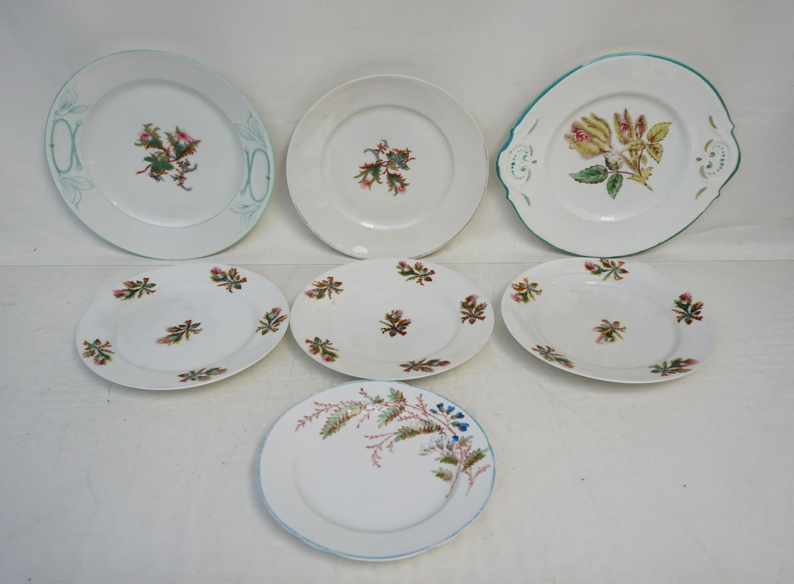 7 pc LIMOGES THISTLE PATTERN: 7 Antique Limoges Thistle Pattern Plates including a Cake Plate. Cake plate 10 1/4" for size reference. Weight on all 5 pds. 8 oz. PROVENANCE: A Sullivans Island SC Private Estate.
