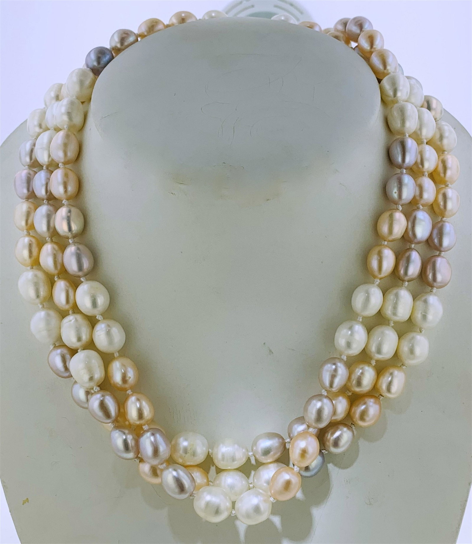 TRIPLE STRAND BAROQUE PEARL NECKLACE (155.20 GRAMS).: One triple strand freshwater baroque pearl 20.00" necklace. The necklace features three strands and a total of one hundred eleven (111), full drilled, baroque freshwater cultured pearls held together 