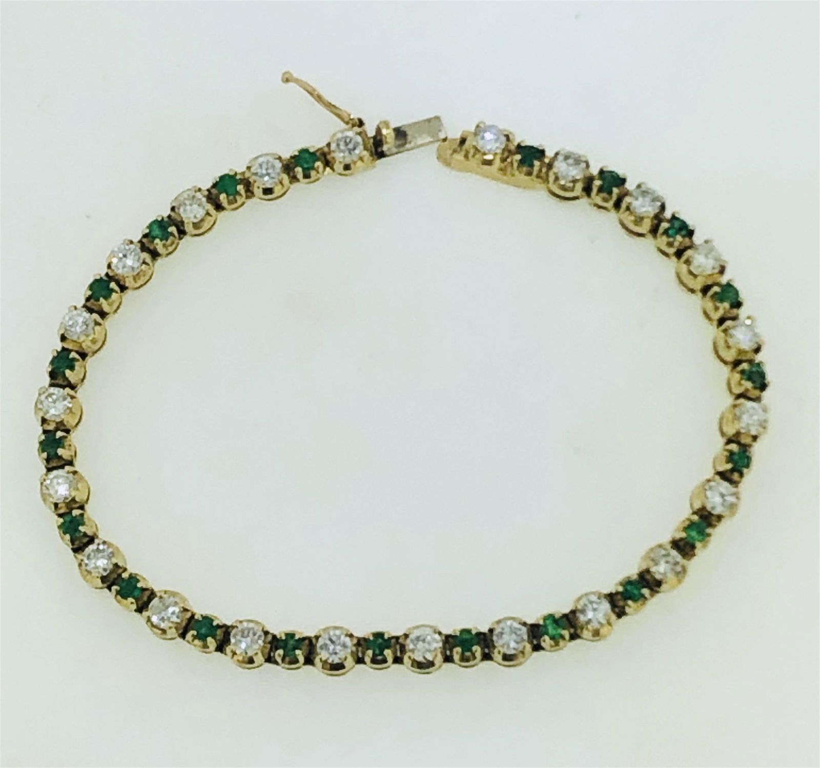 14KT GOLD EMERALD & DIAMOND TENNIS BRACELET (14.90 (1 of 4)