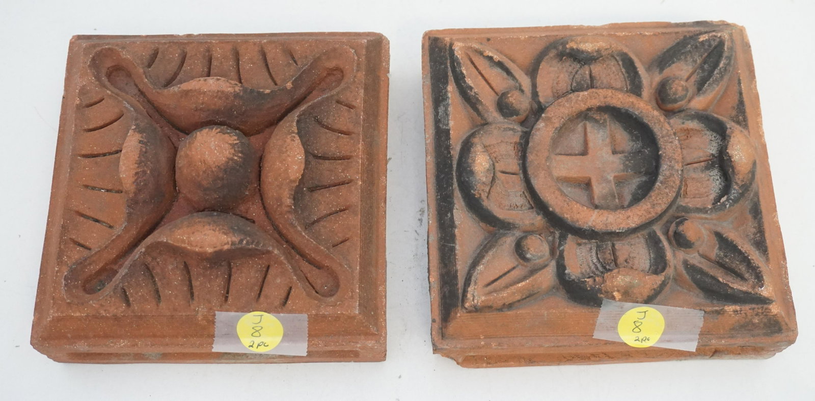 2 NYC ARTS & CRAFTS ERA TERRACOTTA CORNER BLOCKS: Two Piece Architectural Salvage NYC Arts & Crafts Era Terracotta Tile Corner Blocks. Each approx 6"x6"x2 3/4". Weight 6 pds 8 oz. PROVENANCE: A Charleston SC Private Estate.