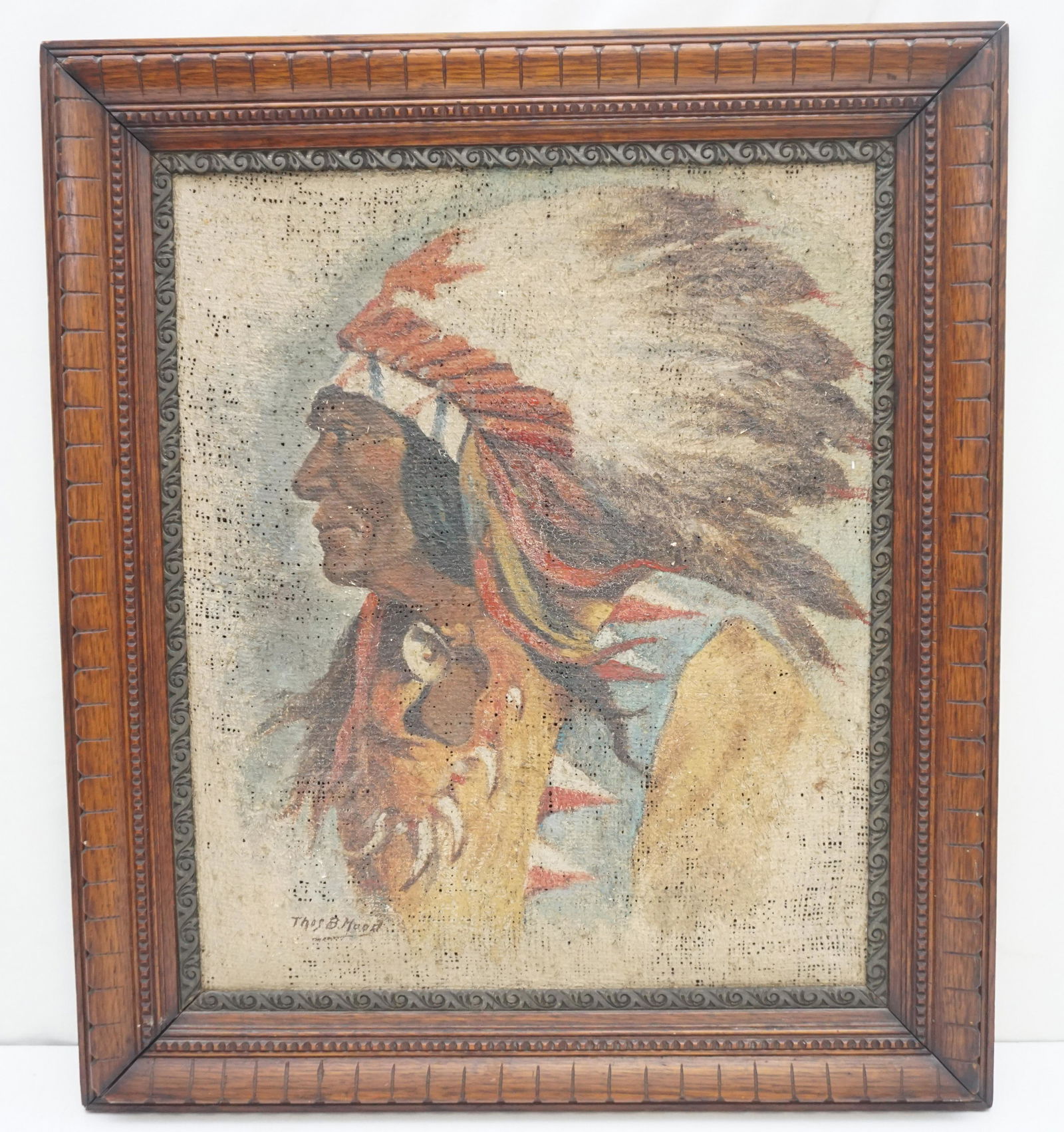 1910-20s NATIVE AMERICAN OIL ON BURLAP - THOMAS HOOD: Antique Native American Chief painted on Burlap signed Thos B. Hood. Thomas B. Hood was a listed Itinerant Artist , who painted c. 1910-1920s. In carved wood frame. In frame, measures 22"x26"x2". Weig