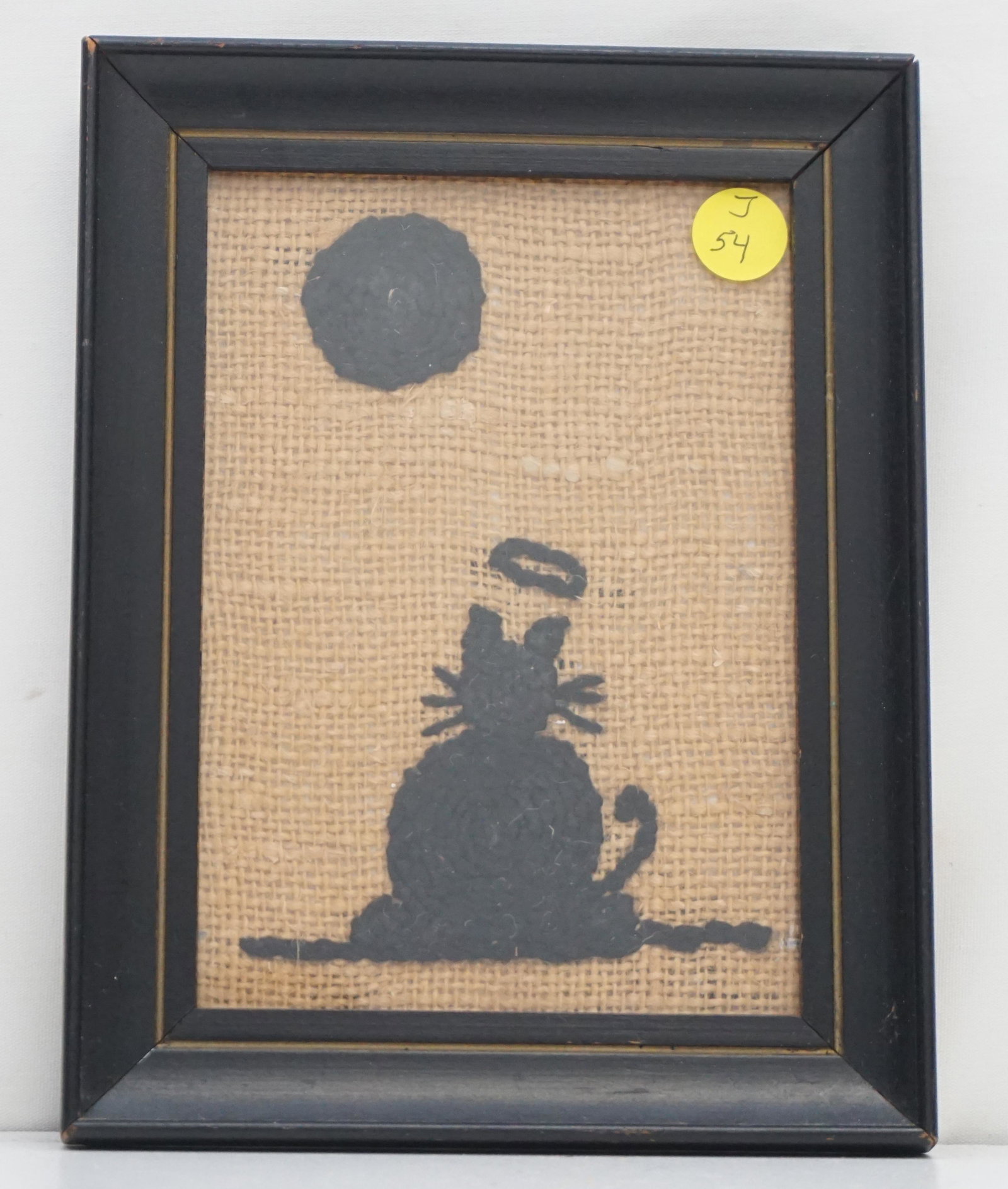 FOLK ART CAT MEMENTO MORI SILHOUETTE WOOLWORK: American Folk Art Woolwork Cat Momento Mori. Silhouette Cat with Halo on Burlap. In frame 6 1/2"x8 1/2"x3/4". Weight 13 oz.