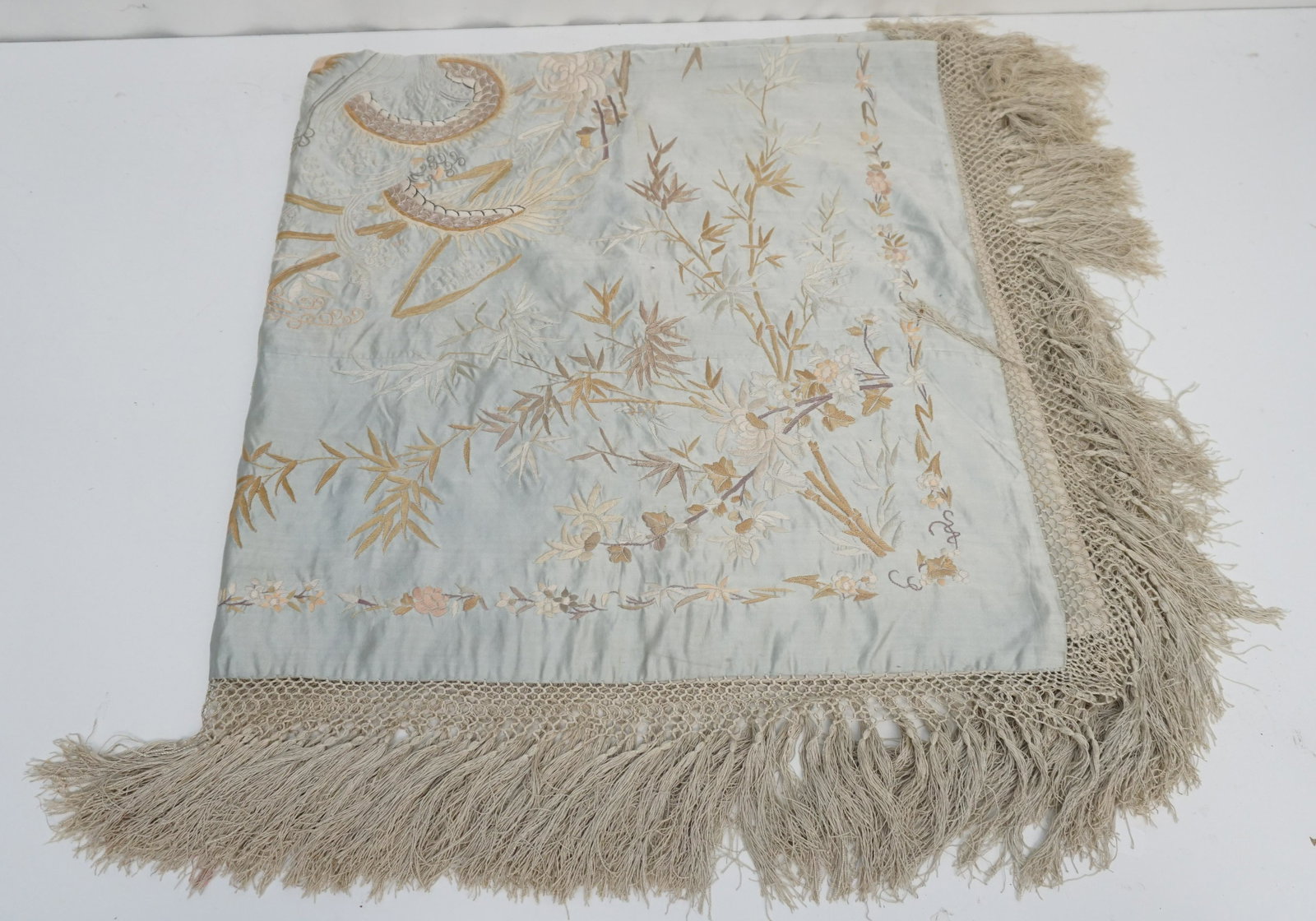 CHINESE QING DYNASTY EMBROIDERED SILK PIANO SHAWL: Exceptional Chinese Qing Dynasty Embroidered / Needlework Silk Piano Shawl. Pale Blue Silk with detailed Jiaolong in center and hand knotted silk fringe lined in a cream silk. Measures with fringe 48"
