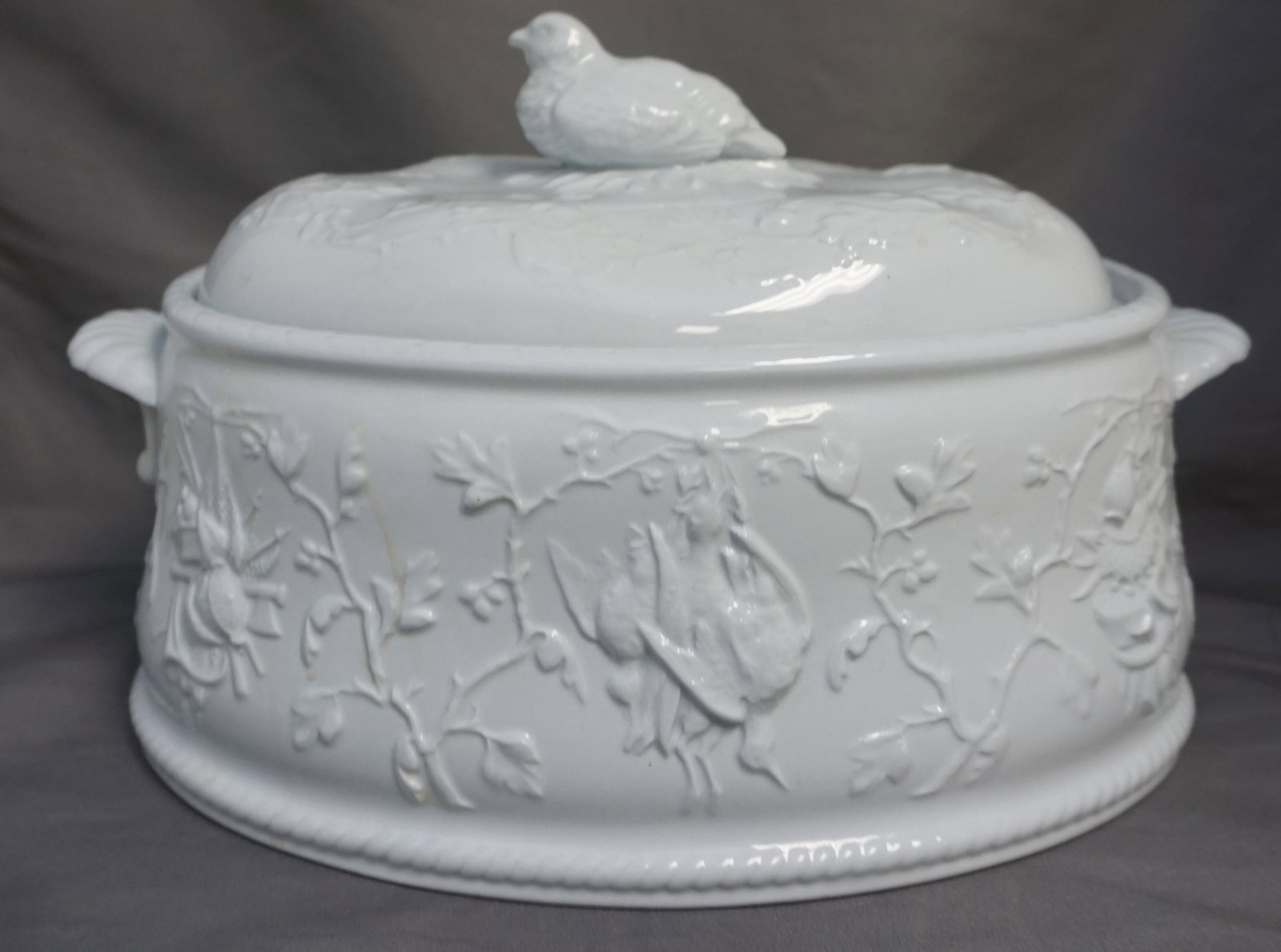 COPELAND SPODE HENRY IV COVERED CASSEROLE: Copeland Spode Alenite Henry IV Oval Covered Casserole 11 3/4”x 9”x 7 1/4". Made by Spode in the 1960s. The ovenware is lidded with a bird on top, and relief hunting scenes around the side