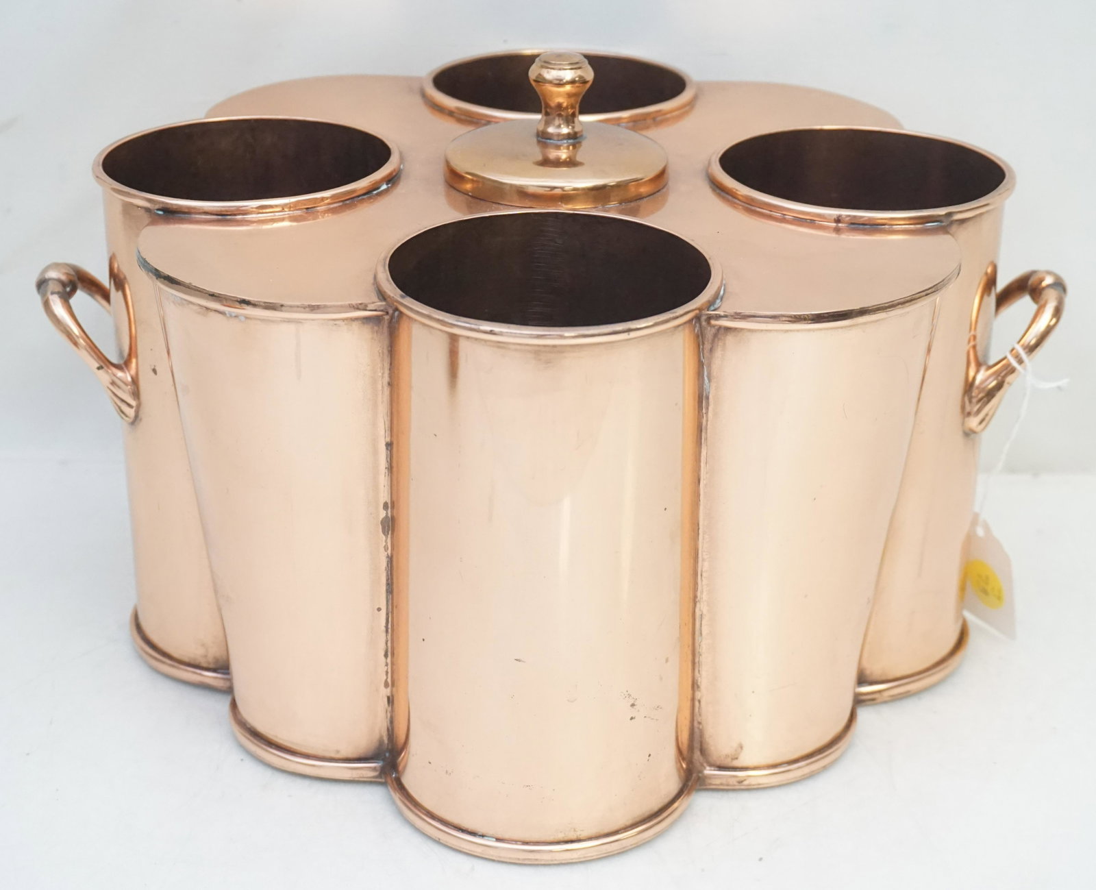 COPPER MULTI BOTTLE WINE / CHAMPAGNE CHILLER COOLER: Copper Multi Bottle Wine / Champagne Chiller / Cooler. The tapering round bodies with a central lid, concealing an internal reservoir for ice, surrounded by four angled compartments for wine or champa