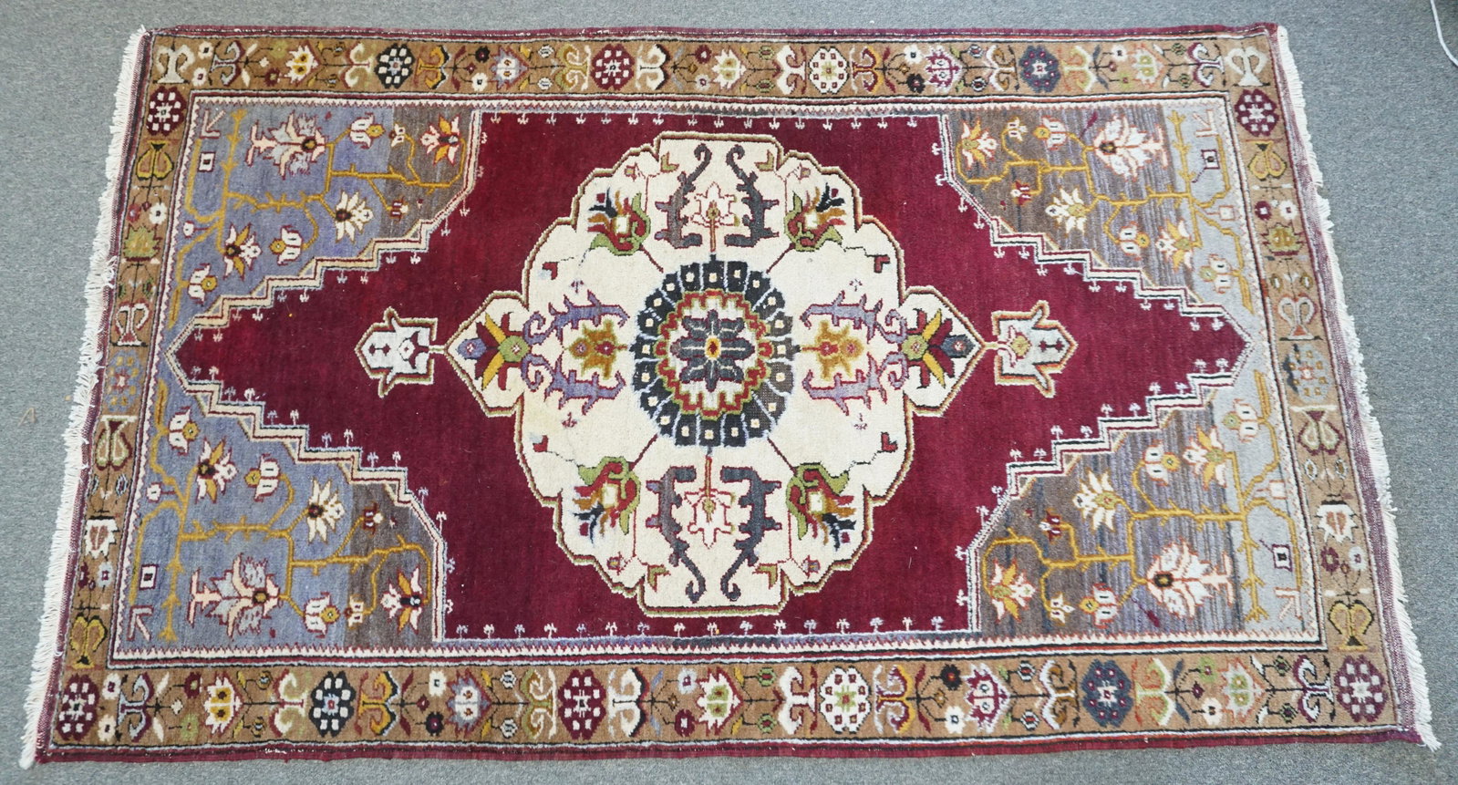 HAND KNOTTED TURKISH HALI RUG 6 FT.: Hand Knotted Turkish Anadol Hali Area Rug. Measures approximately 4"x6". Purchased at Gureli Hali in Turkey, with three generations of Turkish rug experts, making it one of the one of the top quality 