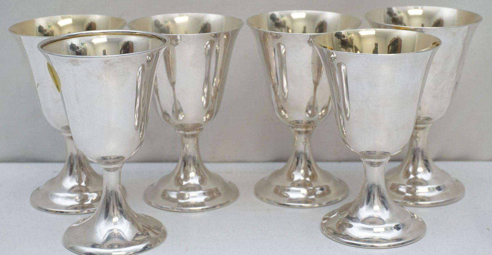 6 INTERNATIONAL STERLING WINE GOBLETS LORD SAYBROOK: Six (6) International Silver Sterling Silver Lord Saybrook Wine Goblets with Gold Wash. 5 are #11951 and 1 with rolled rim is #P703. Silver weight on all combined is approximately 490 grams. Good cond