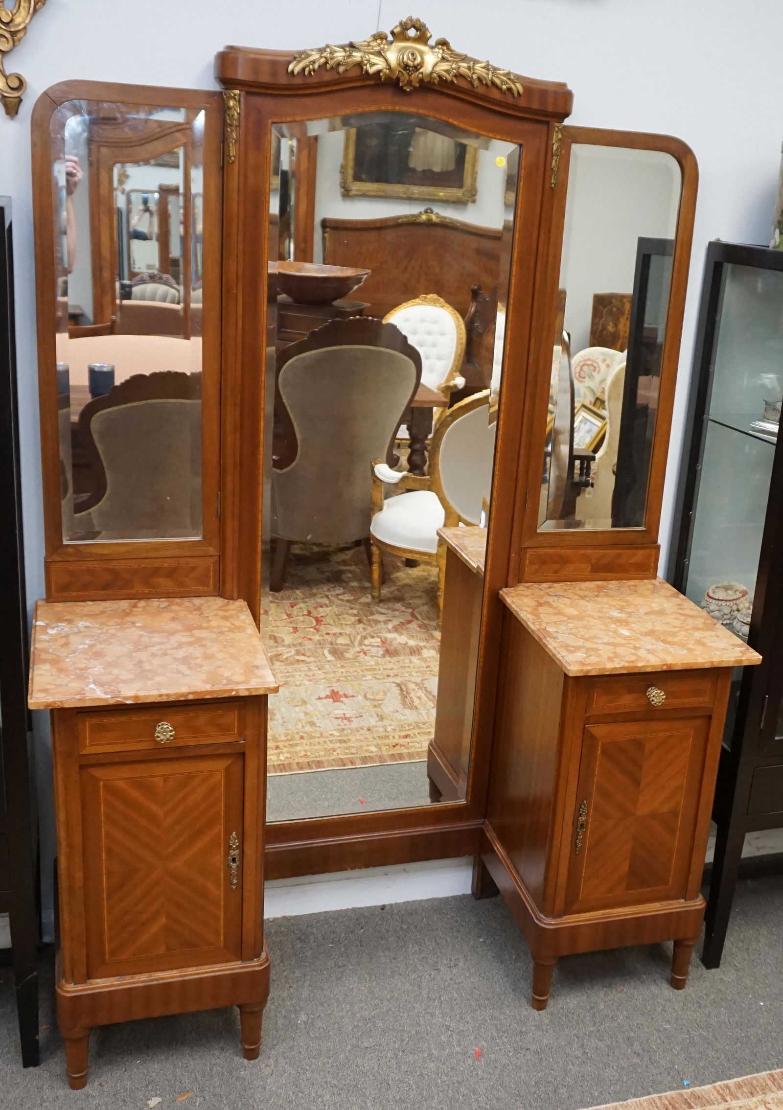 LOUIS XVI ORMOLU MOUNTED MARQUETRY VANITY: French Antique Louis XVI Ormolu Mounted Marquetry Vanity. With the original beveled mirror. 2 Side drawers over cabinets and red marble tops. Measures 53"x19"x77" NO IN HOUSE SHIPPING ON THIS LOT. PRO