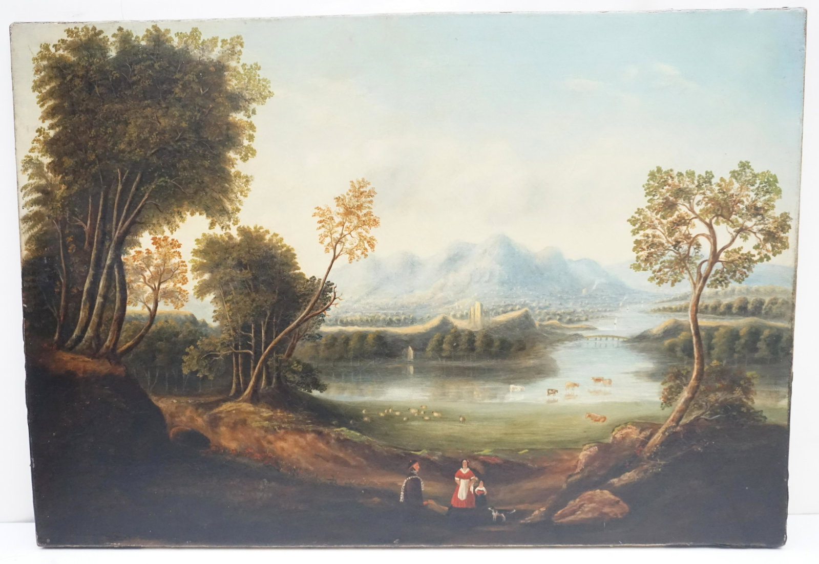 SCOTTISH RIVER SCENE SHEPHERD & FAMILY: Scottish River Scene Shepherd and Family. Cattle and Sheep in the background. Castle, Mountains and Boats in the distance. The painting is relined, has craquelue and scattered loss. Please see all pho