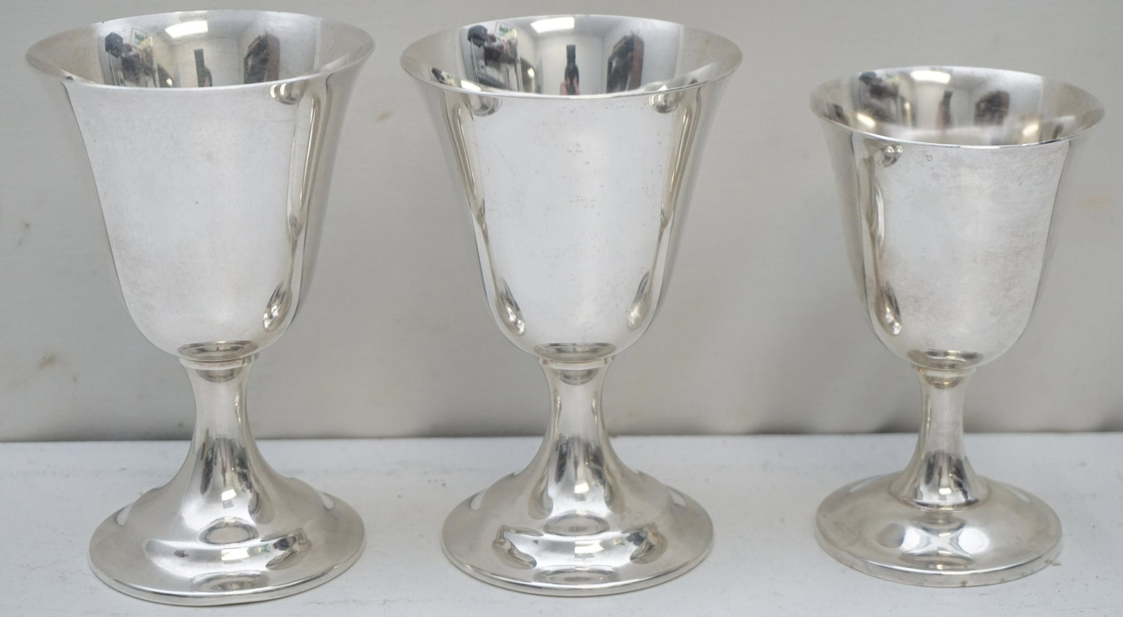3 AMERICAN STERLING SILVER WINE GOBLETS: 3 American Sterling Silver Wine Goblets, each by different makers. Wallace Sterling #24 measures 4". International Silver Lord Saybrook #11951 measures 4 3/4". 1 International Silver 4 1/2". Approxima