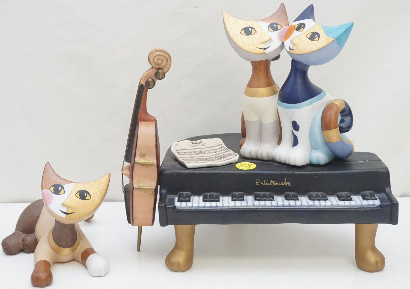 2 PC GOEBEL CATS ROSINA WACHTMEISTER MUSIC BOX: Vintage 1980s Goebel Porcelain Rosina Wachtmeister Cats Music Box and Figurine. The Music Box is signed by the artist and is working 9 3/4"x7 1/2"x9". The Figurine is 7 long. Weight on all 2 pds 2 oz.