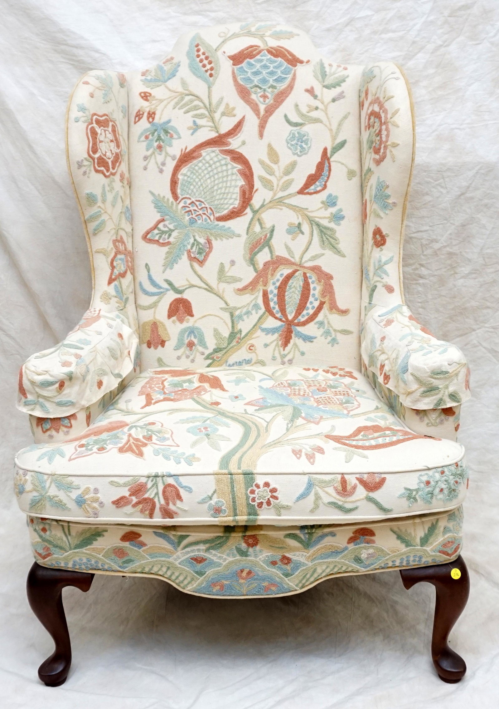 VINTAGE WOODMARK ORIGINALS WING BACK: A fabulous Vintage piece for any interior deisgner to invorporate a fun local piece. Circa 1985 this wing back was purchased at Southeastern Galleries. The chair sits atop solid mahogany legs in the Q