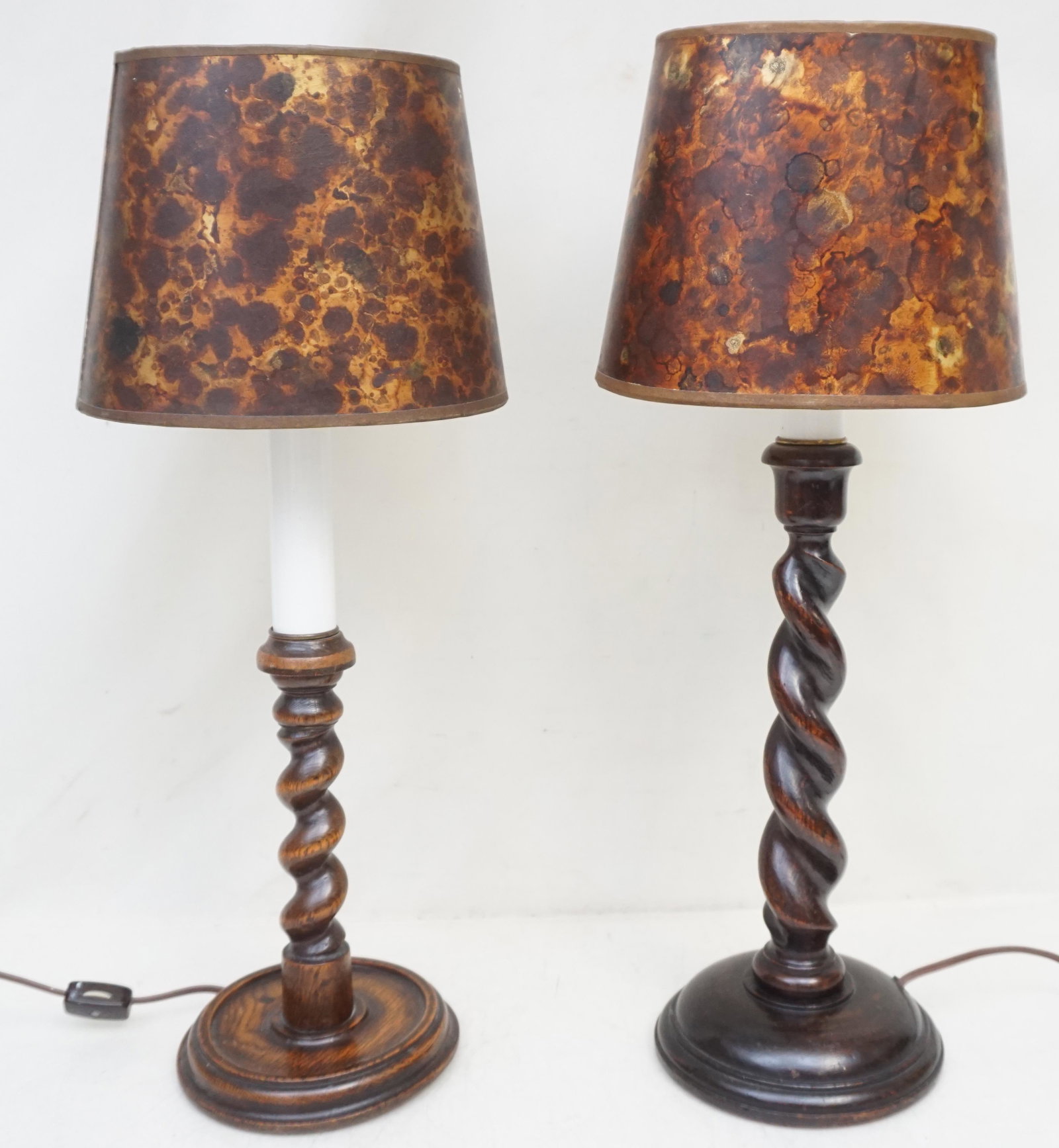 ENGLISH TURNED WOOD CANDLESTICKS - ELECTRIFIED: Two Antique English Turned Candlesticks mounted as lamps. One walnut and one oak. Both 19 1/4" Tall. Weight combined 4 pds. PROVENANCE: A Private Charleston SC Estate.
