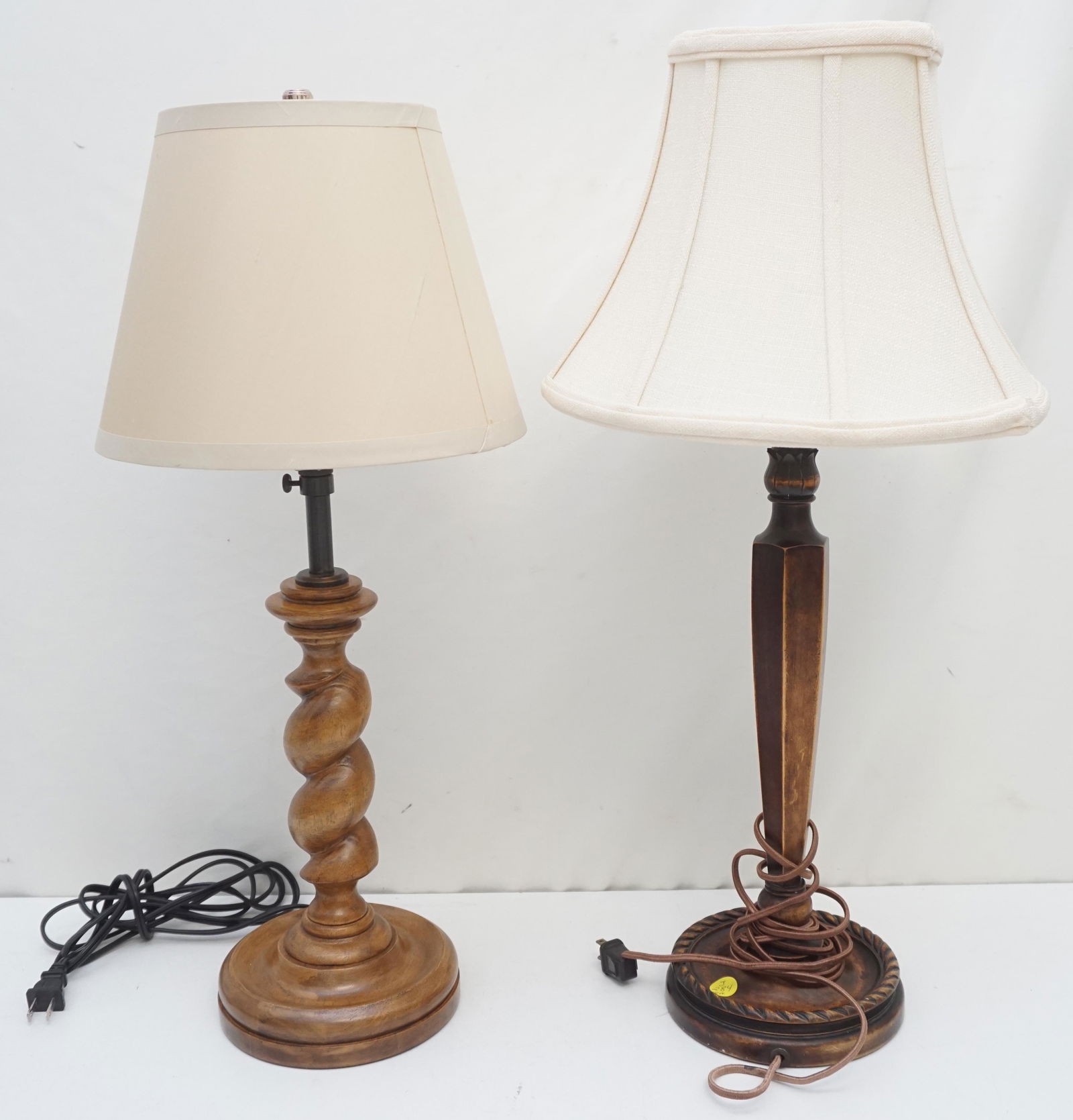 2 VINTAGE WOOD TABLE LAMPS: 1- Turned Wood Table Lamp 23" to top of shade. 2- Wood Table Lamp 24: to top of shade. Tear to silk lining one shade. Weight combined 7 pds PROVENANCE: The Historic Reverend Paul Trapier Gervais House