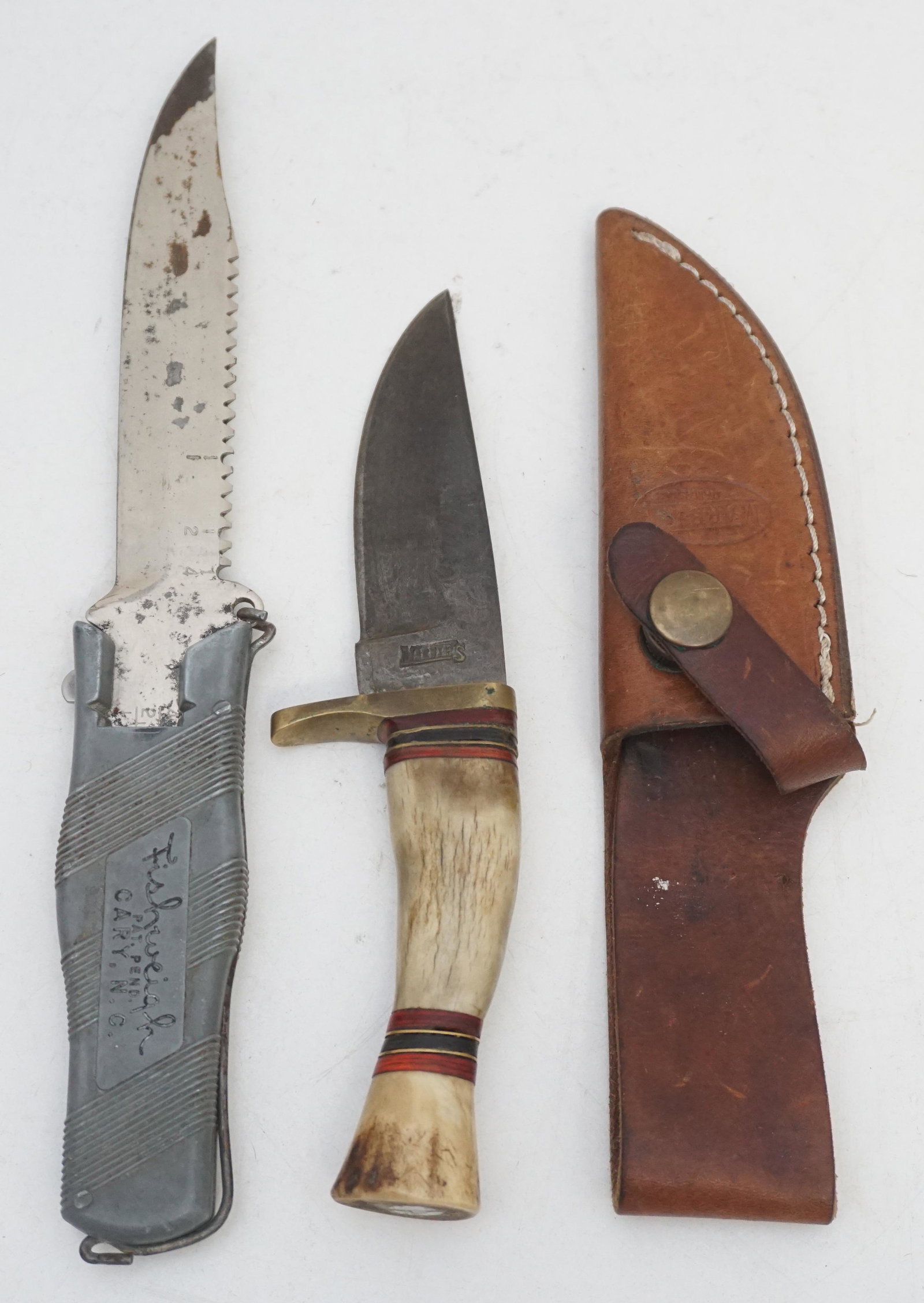 2 VINTAGE FISHING / HUNTING KNIVES: Marbles Inlaid Stag Handle Damascus Blade Knife 7 1/4" with Leather Sheath. Vintage Fishweigh Knife, Cary NC with a weighing scale inside the handle 9 1/2". Weight combined 1 pd. PROVENANCE: A Private