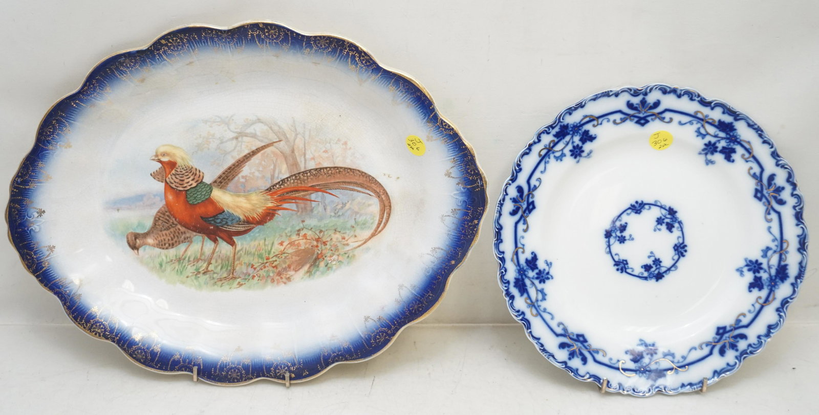 2 ANTIQUE FLOW BLUE PLATTER & PLATE: Antique Pheasant Transfer Platter with Flow Blue Rim 15 1/2"x12"x1 1/2". 2- Johnson Bros "Oxford" Flow Blue Plate. 10". Weight combined 3 pds 10 oz. PROVENANCE: A Private Charleston SC Estate.