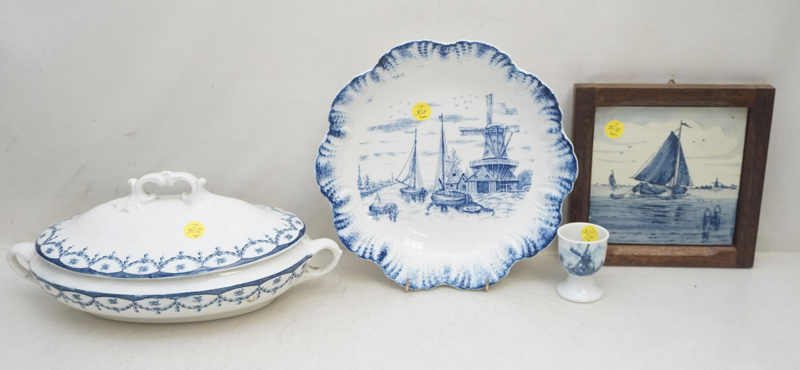4 PC WEDGWOOD & DELFT PORCELAIN / CHINA: 1- Delft Hand Painted Tile in Wood Frame 7 3/4" 2- Antique Flow Blue Serving Bowl Semi Vitreous Canton China Windmill Transfer 10". 3- Delft Egg Cup 2 1/2". 4- Wedgwood Covered Vegetable, firing flaw