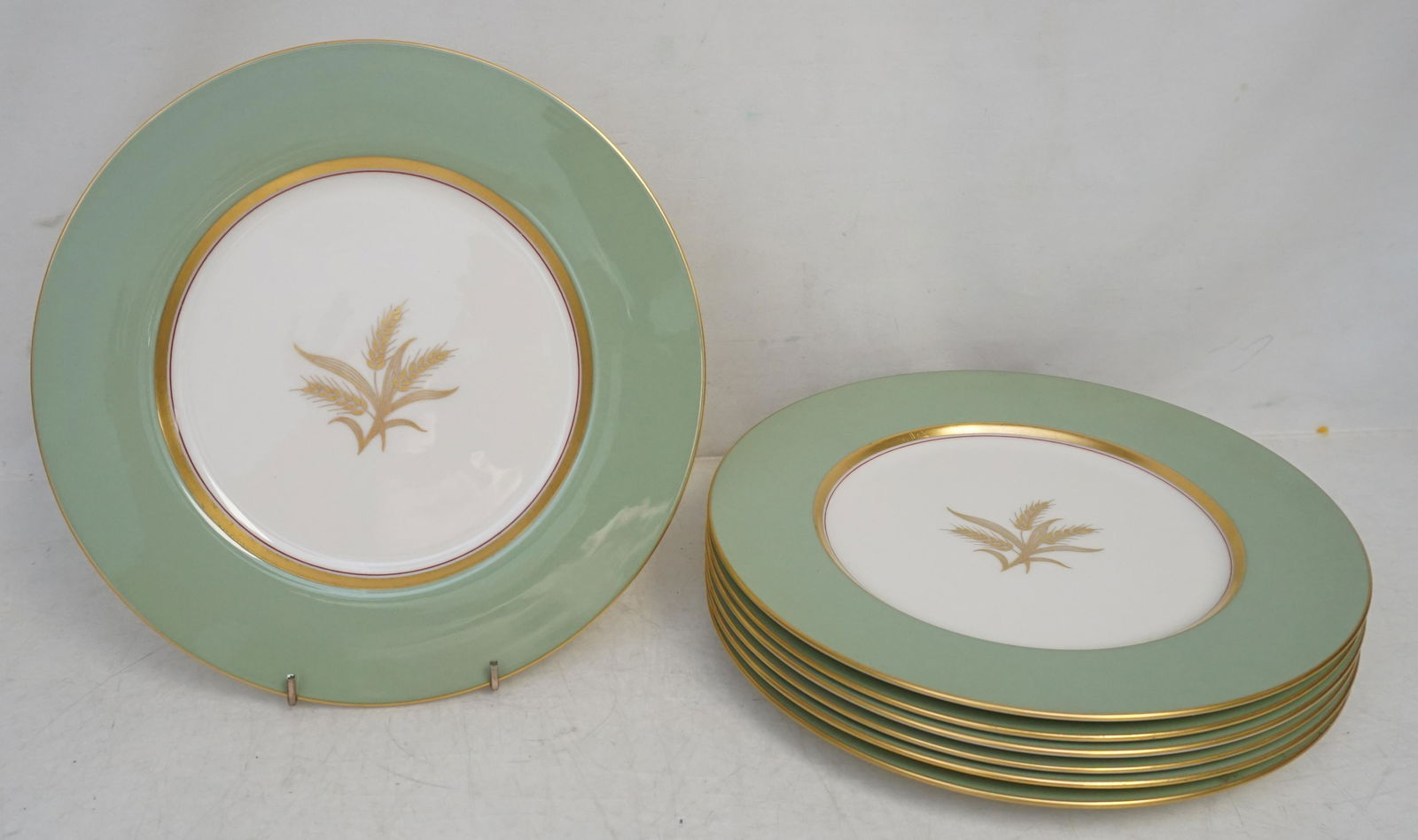 7 LENOX HARVEST GREEN DINNER PLATES: 7 Vintage Lenox Harvest Green Dinner Plates. Sage Green and Cream with gold wheat and rims. Each 10 1/2". Weight 8 pds 8 oz. Good condition. PROVENANCE: A Private Charleston SC Estate.