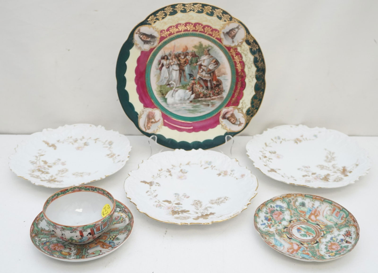 7 PC ANTIQUE PORCELAIN LOT: Portrait Plate c. 1900 Swan King 9 1/2". 3 Coiffe Limoges Dessert Plates. The star mark is a factory mark for Coiffe and is dated 1891-1914. Each 7 3/4". Rose Medallion Tea Cup and 2 saucers. Nick to