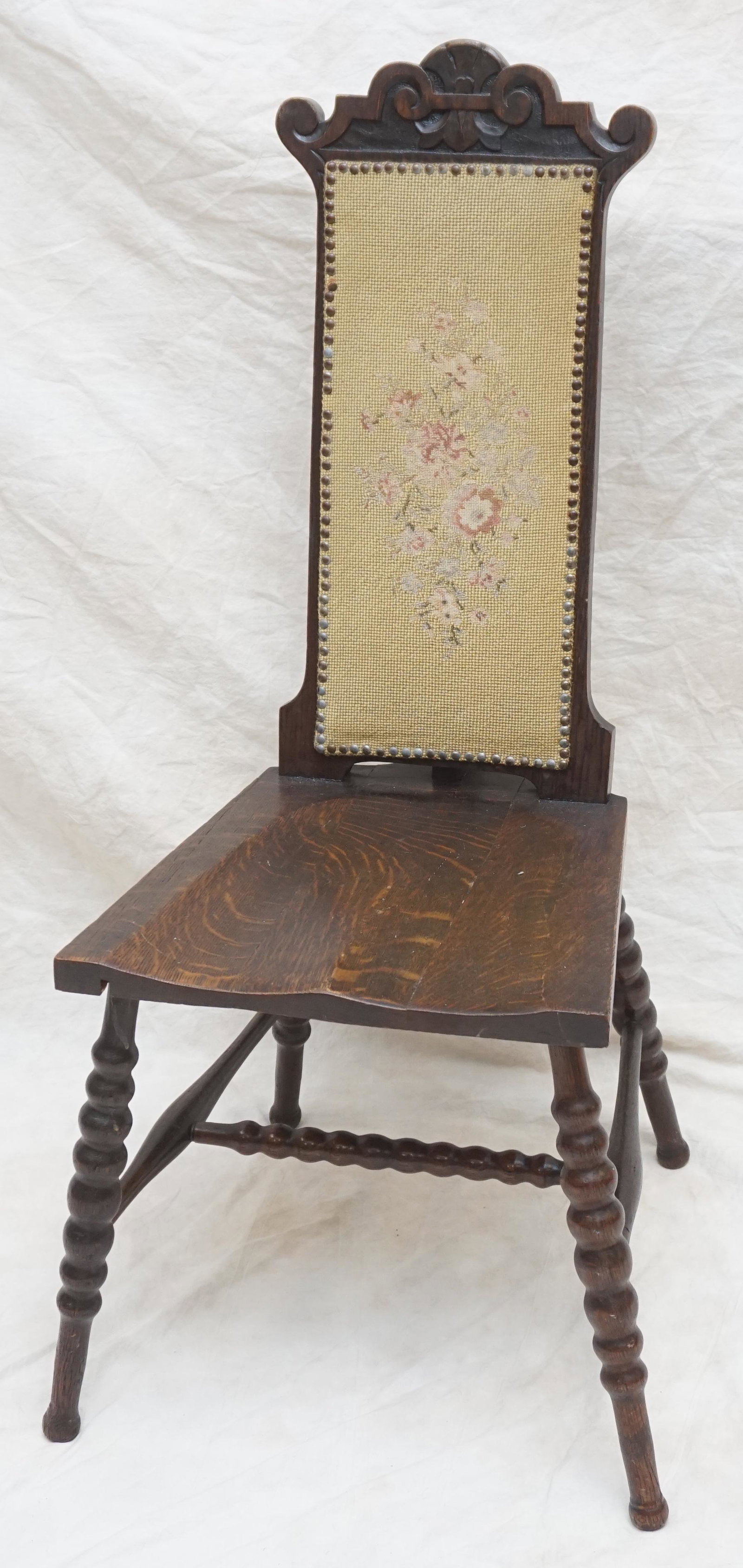 ANTIQUE SOLID OAK HALL / SIDE CHAIR: Antique c. 1900 Solid Oak Side Chair with Original Tapestry Back. Turned supports and carved crest. Measures 16"x19"x39 1/2" . NO IN HOUSE SHIPPING ON THIS LOT. PROVENANCE: A Private Charleston SC Est
