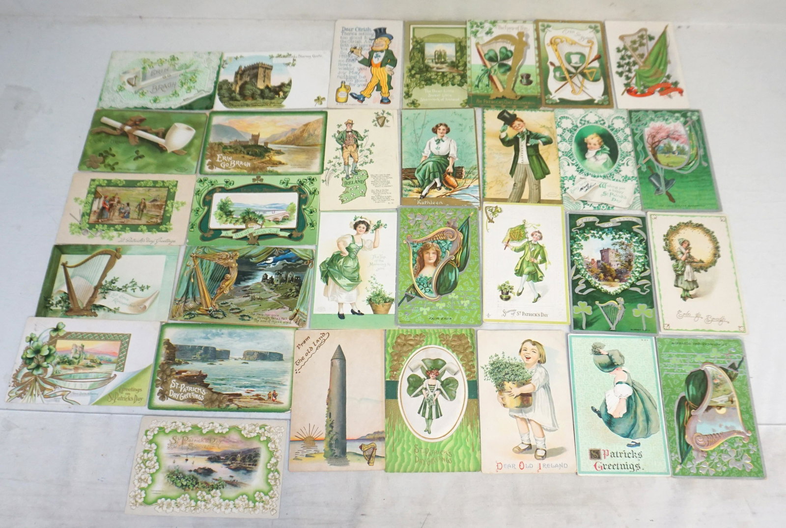 31 ANTIQUE ST PATRICKS DAY POSTCARDS: 31 Antique St. Patricks Day Postcards c. 1905-1920. Many with the original postage stamps.Publishers include Raphael Tuck, International Art, Gottschalk, Dreyfuss & Davis, Julius Bien, HIR and many ot