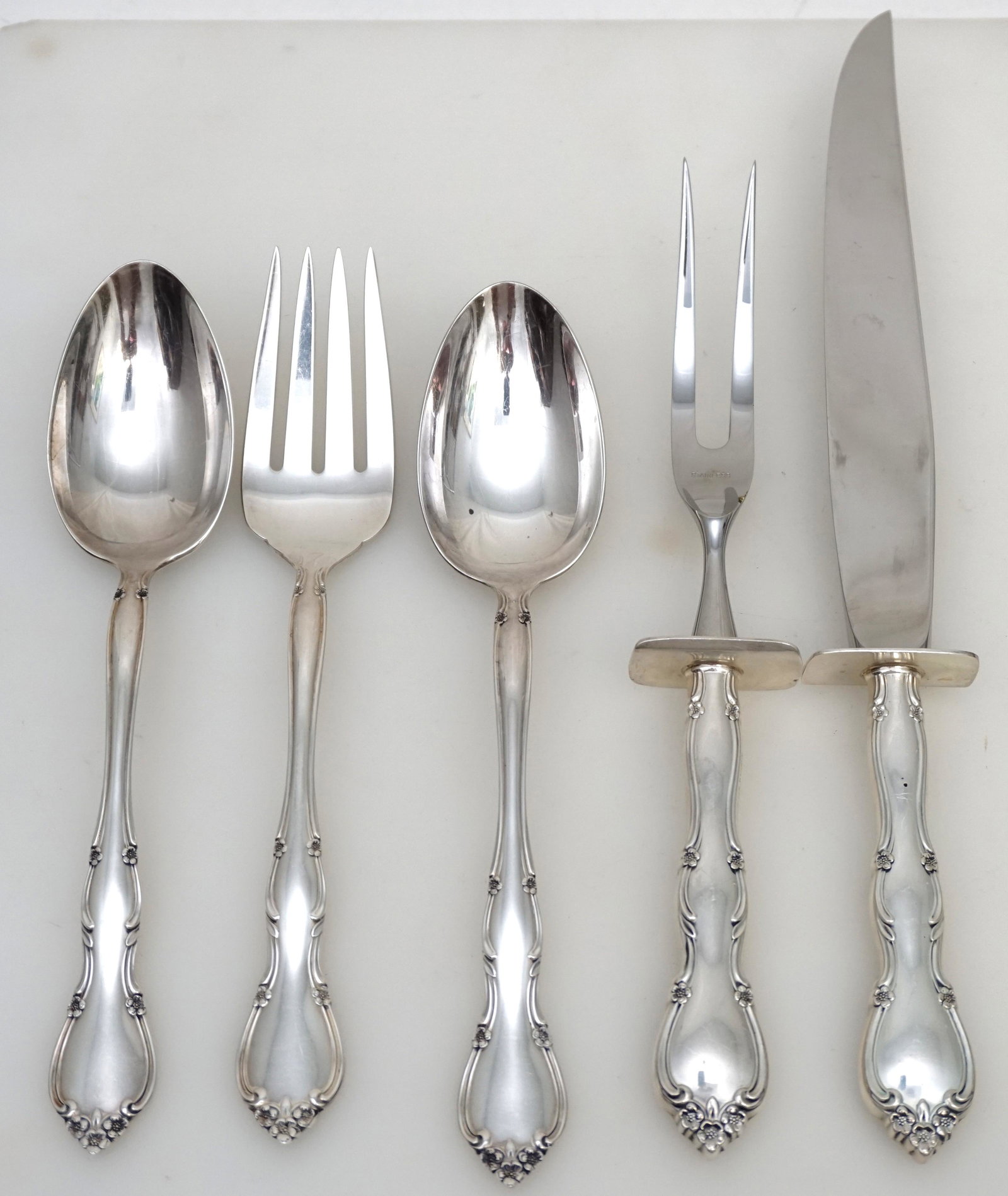 5 PC GORHAM STERLING ROSE TIARA SERVING: Five Piece Gorham Sterling Silver Rose Tiara Serving Items.. No monograms. 2 Tablespoons 8 1/2". Medium Solid Cold Meat Serving Fork 8 3/4". 2 Piece Roast Carving Set with Stainless Blade, Knife 12". 