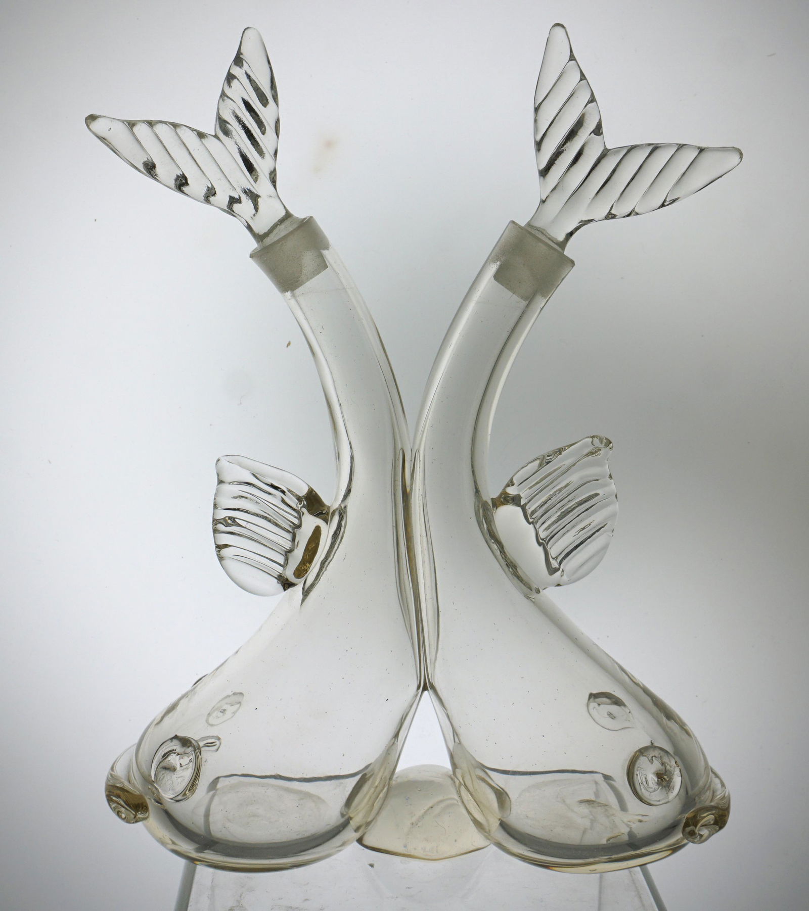 BLOWN GLASS DOUBLE FISH CRUET: Blown Glass Double Fish Cruet. Unsigned. Possibly made by Steuben Glass. Measures 6 1/2" wide and 8 1/2" tall. Weight 1 pd 4 oz. PROVENANCE: A Private Charleston SC Estate.