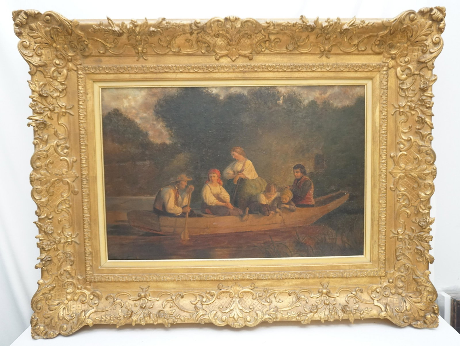 LARGE 19th C. CONTINENTAL OIL FAMILY BOATING: Antique Large Continental Oil on Canvas. A family enjoying a outing on a dory. The painting has a old reline and has been revarnished. Craquelure. Housed in a incredible carved giltwood carved frame. 