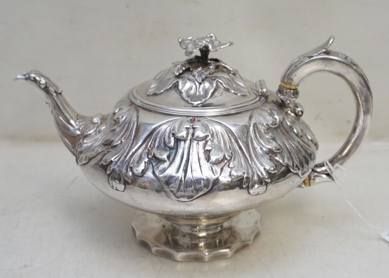 GEORGIAN EXCEPTIONAL STERLING SILVER CHARLES FOX TEAPOT: Scarce Exceptional George IV English sterling silver teapot by Charles Fox, London c. 1825. The teapot has a circular compressed form onto a shaped spreading foot. The upper portion of the body of the