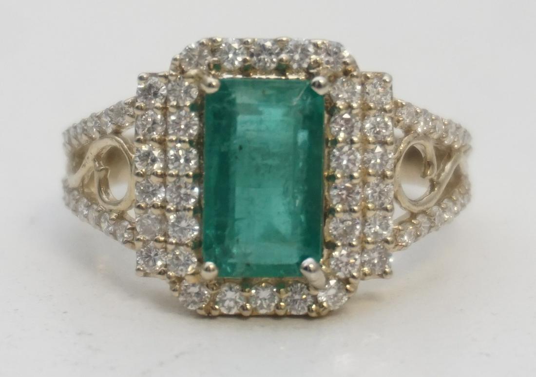 2.01 CT EMERALD & 1.01CT DIAMOND RING (GIA REPORT): Gorgeous 14kt gold emerald & diamond halo design ring. The ring features one (1), four prong set, emerald step cut emerald set in the center surrounded by a halo of twenty two (22), pave set, round br