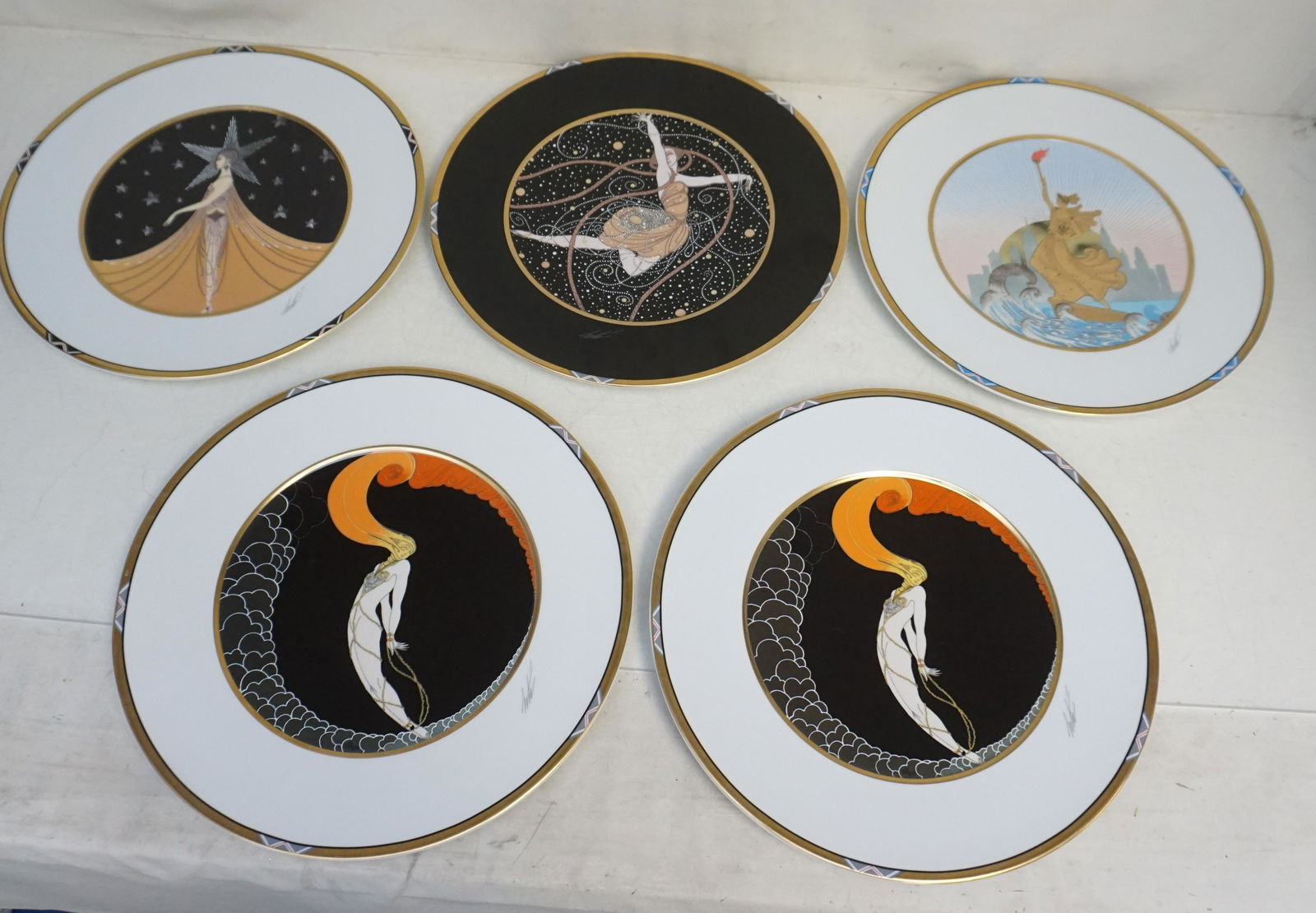 5 LARGE ERTE PORCELAIN CHARGERS: Five (5) Large Vintage Erte Porcelain Chargers. All made in Germany for Sevenarts Ltd. All 12 1/2". Weight on all combined 10 pds 2 oz. NO IN HOUSE SHIPPING. PROVENANCE: A Private Charleston SC Estate