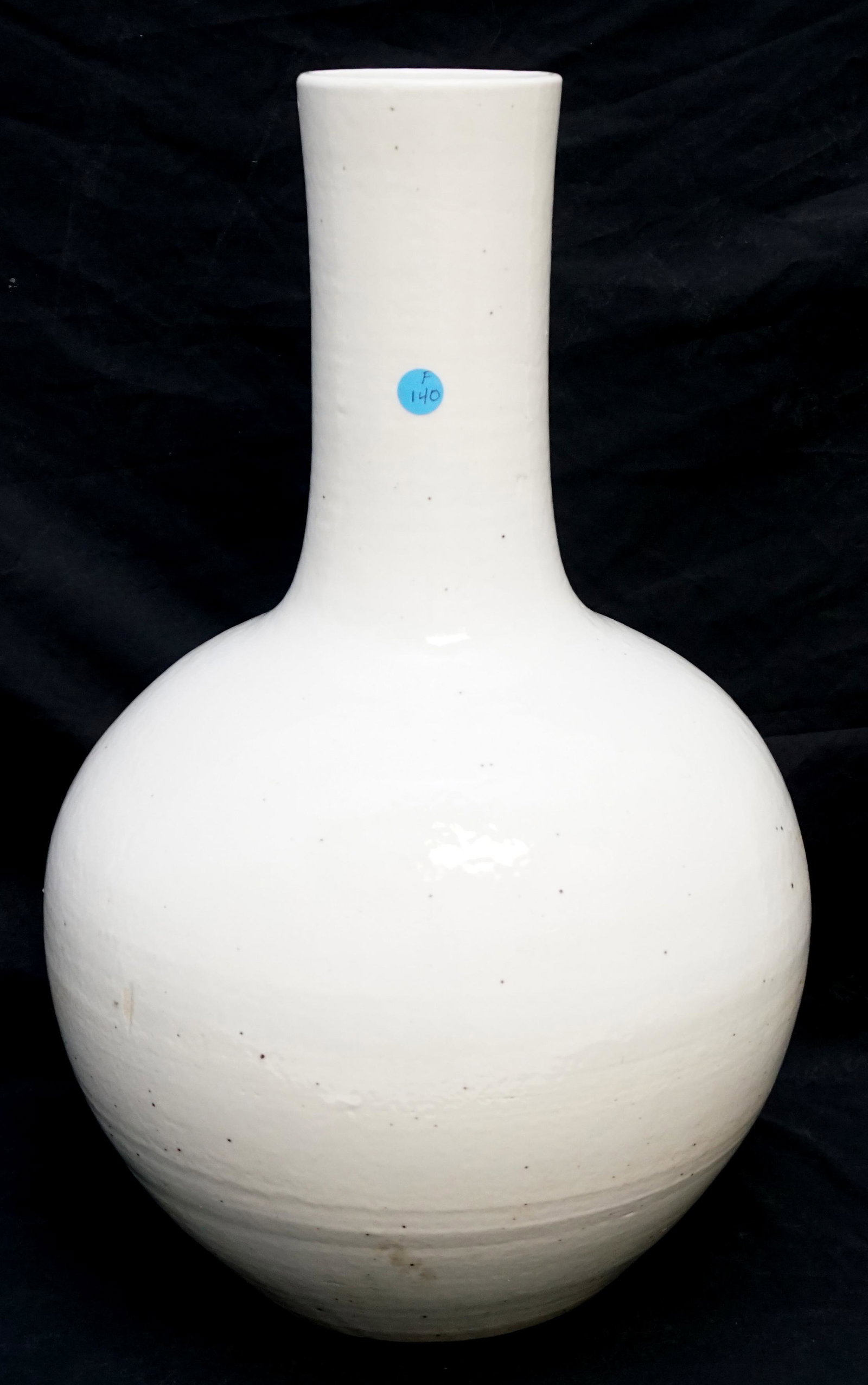 LARGE CHINESE WHITE GLAZED PORCELAIN BOTTLE VASE: Large Chinese Xing Ware Style Porcelain Bottle Vase. Measures 11"x11"x21". Weight 24 pds.NO IN HOUSE SHIPPING. PROVENANCE: A Private Charleston SC Estate.***Pickup only or Shipping on this item offere