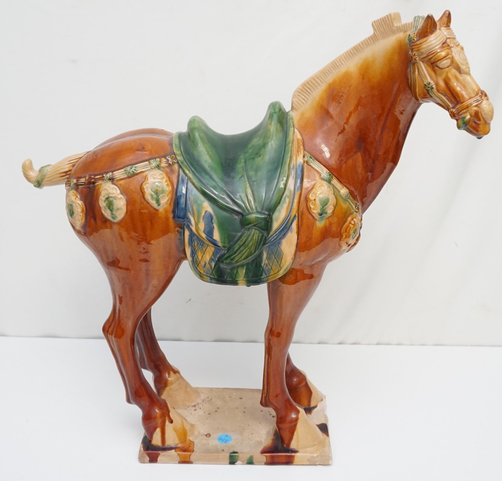 MAITLAND SMITH TANG DYNASTY SANCAI GAZE HORSE: Large Vintage Maitland Smith Tang Dynasty Sancai Glaze Terracotta Horse. Measures 8"x21"x22". Nicks to front edge of base. Weight approximately 22 pds.PROVENANCE: The Estate of Dr. Fraser Wilson, Char