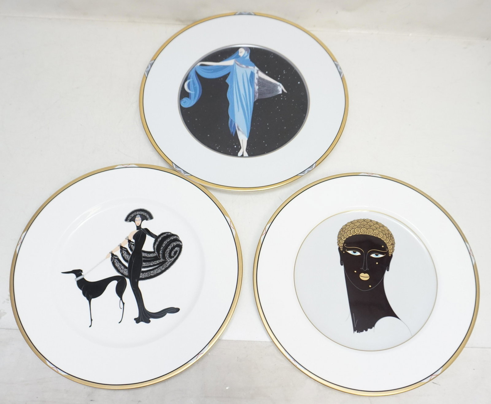 3 LARGE ERTE PORCELAIN CHARGERS: Three (3) Large Vintage Erte Porcelain Chargers. All 12 1/2". Weight on all combined 5 pds 11 oz. NO IN HOUSE SHIPPING. PROVENANCE: A Private Charleston SC Estate. ***Pickup only or Shipping on this i