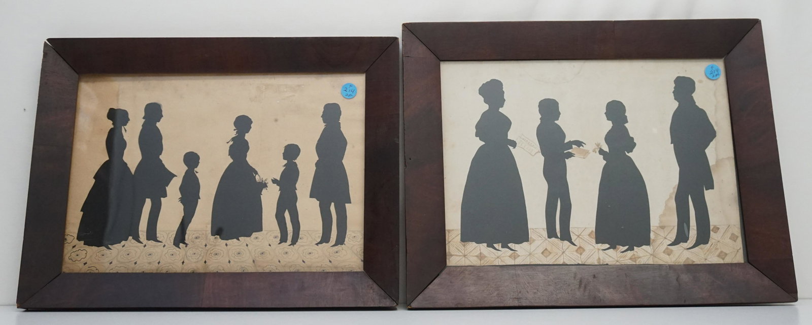 2 19TH C FAMILY CUT OUT SILHOUETTES: Two Antique 19th c Family Cut Out Silhouettes with Painted Details. In antique wood frames. One with four figures has water damage to one side. 17 1/4"x13 1/4"x1" and 17"x12 1/2"x1 1/4". Weight combin