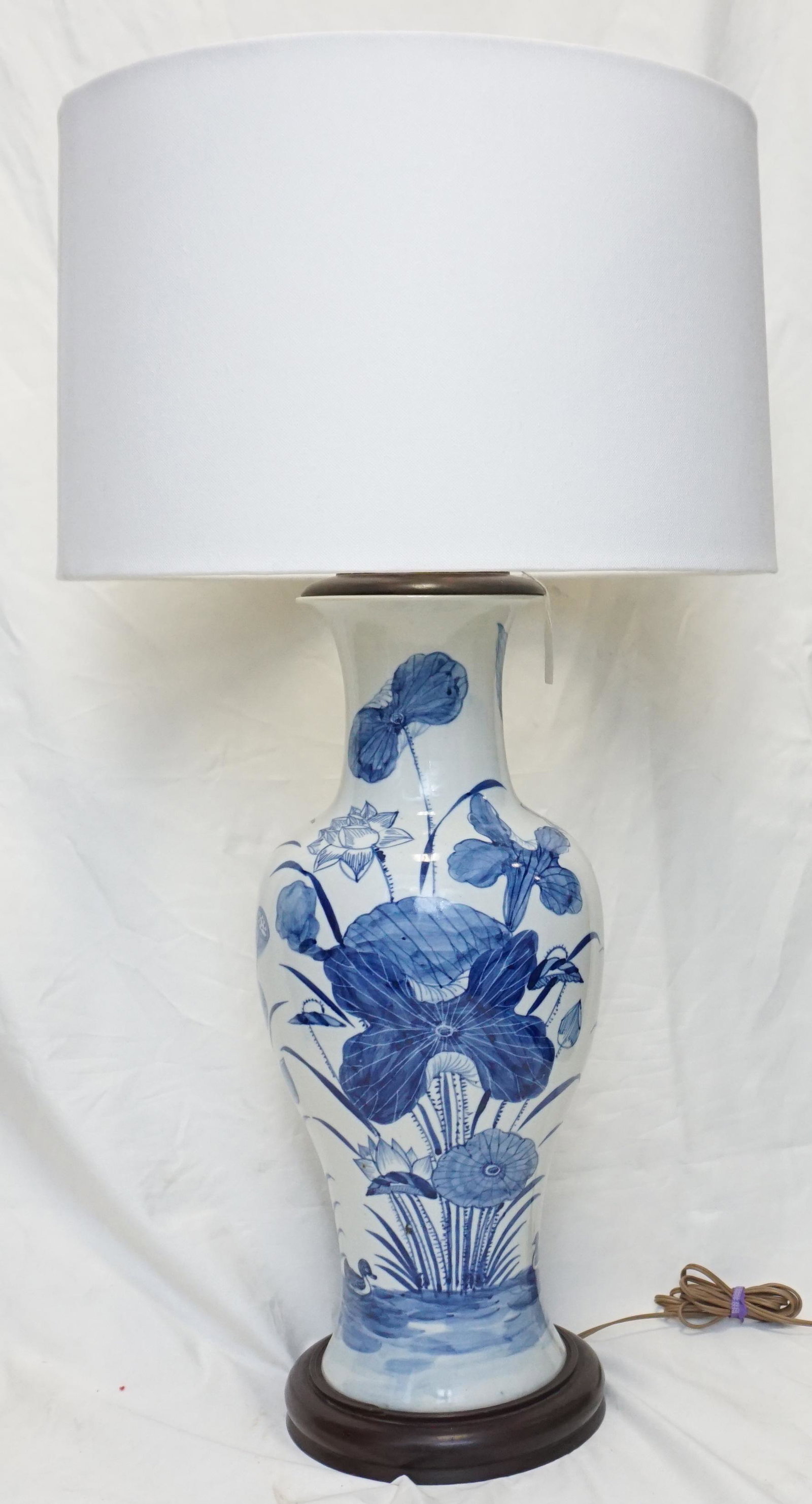 LARGE CHINESE VASE MOUNTED AS LAMP: Large 20th c. Chinese Blue and White Porcelain Vase, mounted as a lamp. Pond Landscape with lily pads, lotus and ducks, wood base and cap. Lamp 27" without harp or shade. Shade 17"x17"x11". Weight 17 