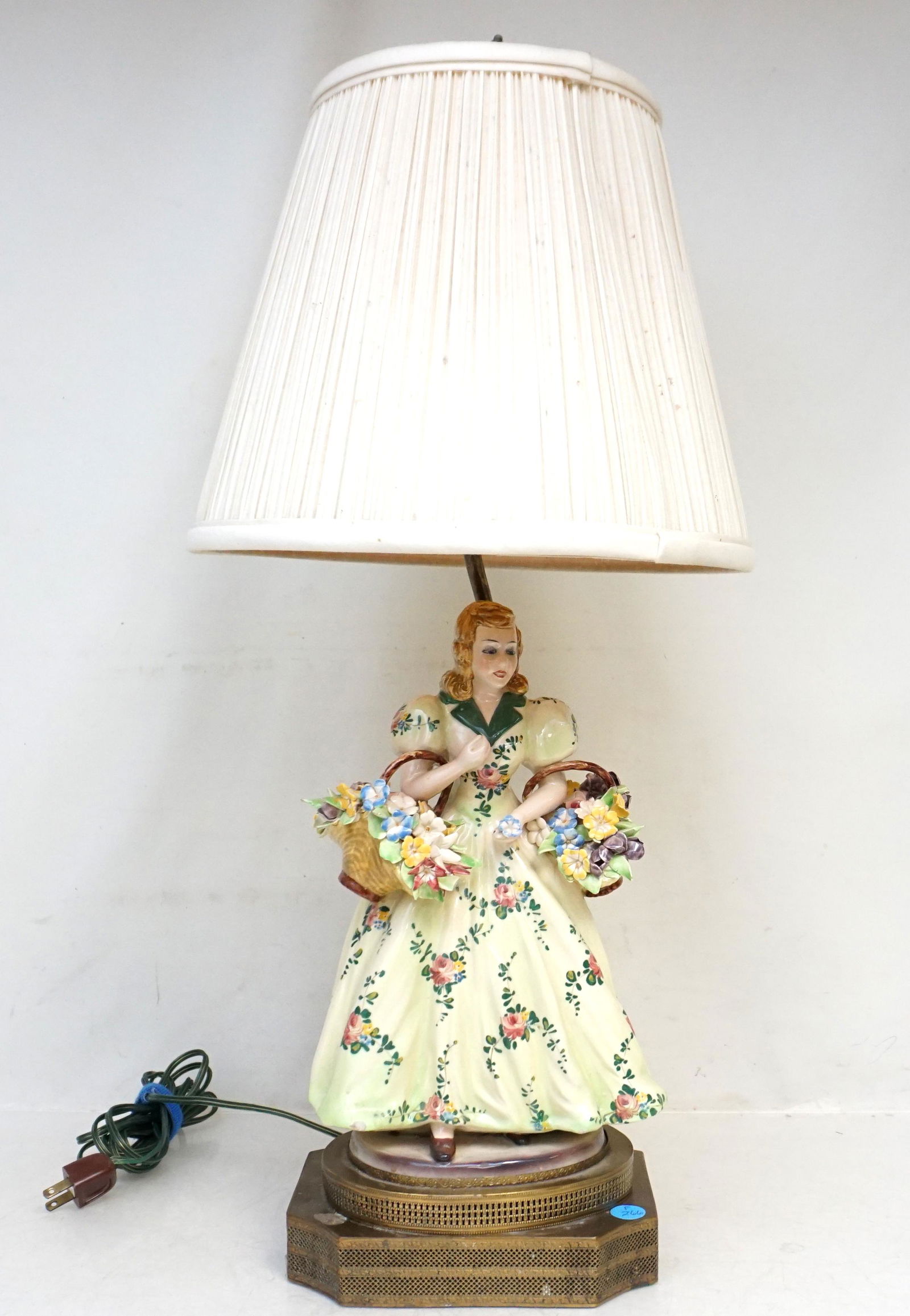 MID CENTURY CAPODIMONTE FLOWER LADY LAMP: Mid Century Italian Capodimonte Flower Lady Figurine mounted as a lamp. Measures 27" to top of shade. Weight 6 pds 8 oz. PROVENANCE: The Estate of Dr. Fraser Wilson, Charleston SC. Dr. Wilson will be