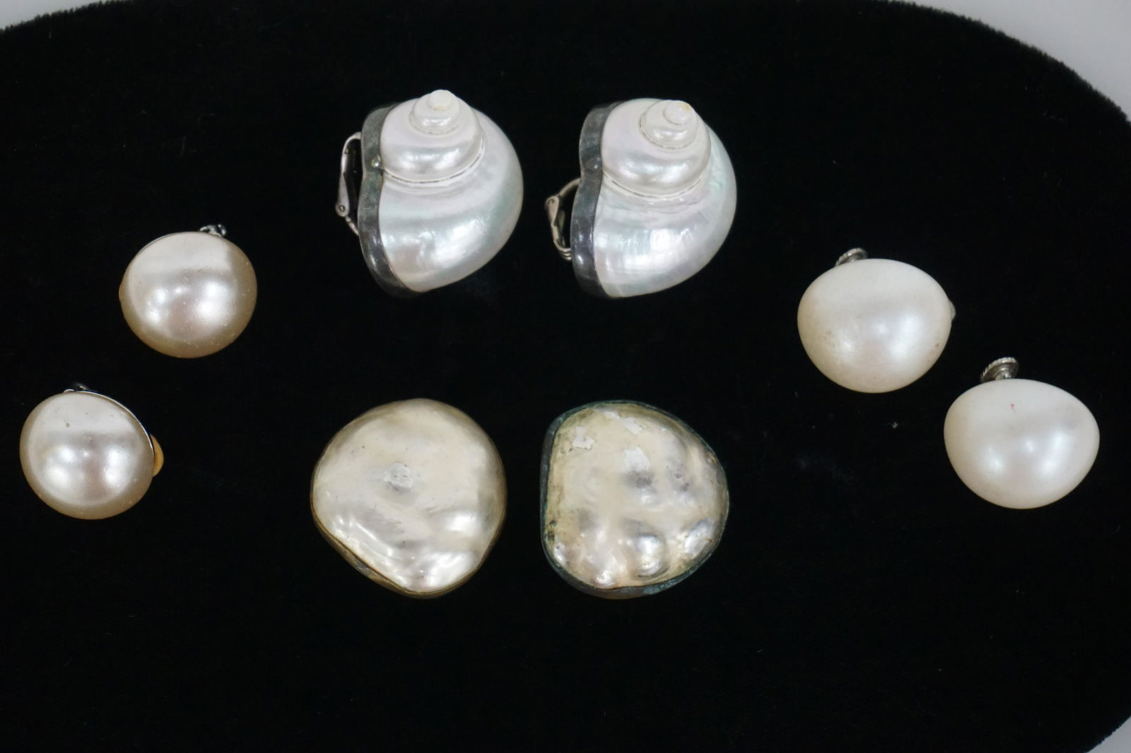 VINTAGE BETSY FULLER & ERWIN PEARL EARRINGS: Designer pair of Sterling silver mother of pearl snail clip earrings.Betsy Fuller signed #29. Measures 1” in length. William De Lillo / Erwin Pearl clip earrings. Total weight approx. 2.5 oz