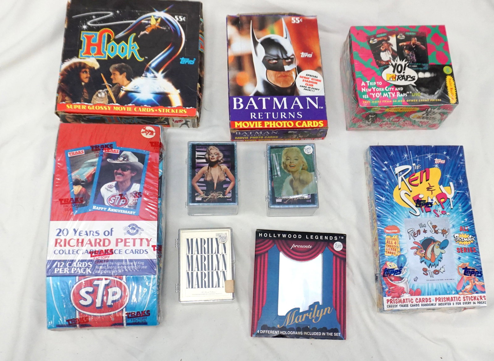 1990’s POP CULTURE/ MEMORABILIA COLLECTORS CARDS: Large lot of 90’s memorabilia collectors cards. 1991 Yo! MTV Raps factory sealed music cards, 1993 Ren & Stimpy all prismatic trading cards factory sealed box, 1993 Marilyn Monroe collector card set