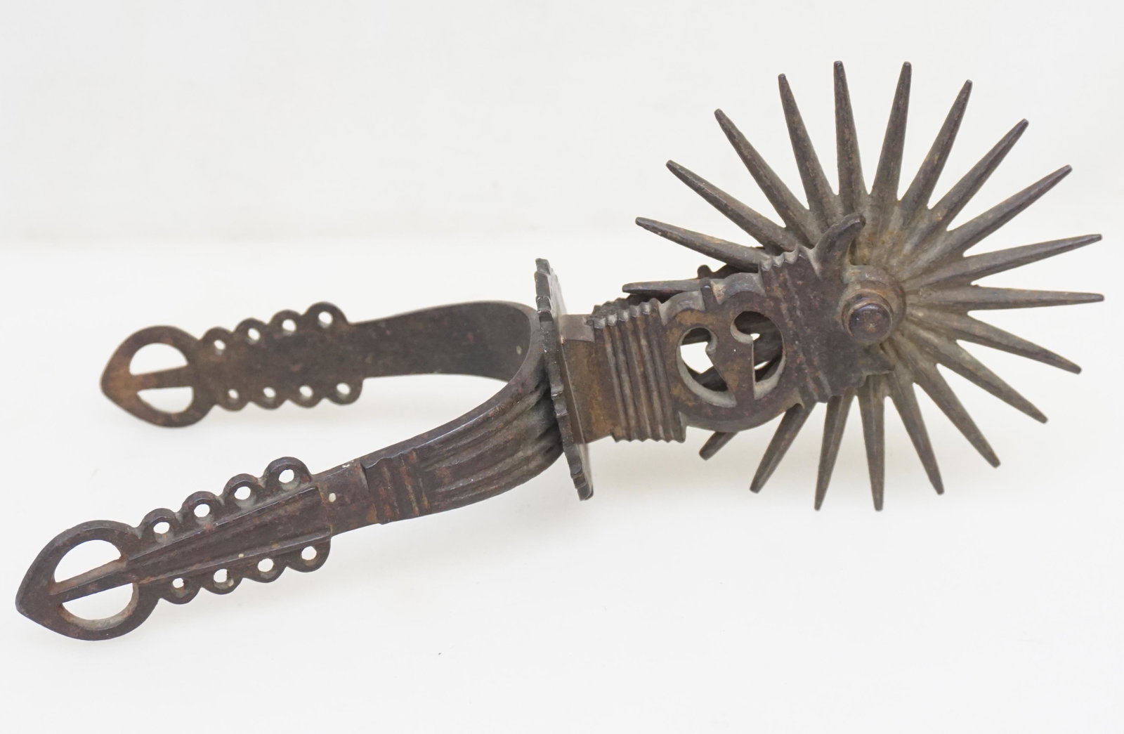 18th c SPANISH COLONIAL IRON SPUR: 18th c. Spanish Colonial Iron Spur. Perfect for use as a paperweight. Measures 3 3/4"x9"x4". Weight 15 oz. PROVENANCE: A Private NYC/ Charleston SC Estate.