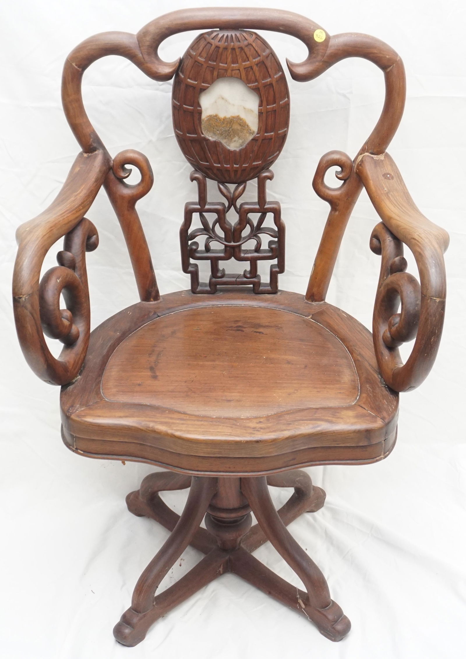 CHINESE HONGMU CARVED OFFICE CHAIR: Unusual Chinese export hongmu swivel arm chair with Chinese Dream Stone inset.. Late Qing Dynasty. Hand carved, dowelled and pegged. Marble Dream Stone inset in ornate carved back splat. Scrolled and
