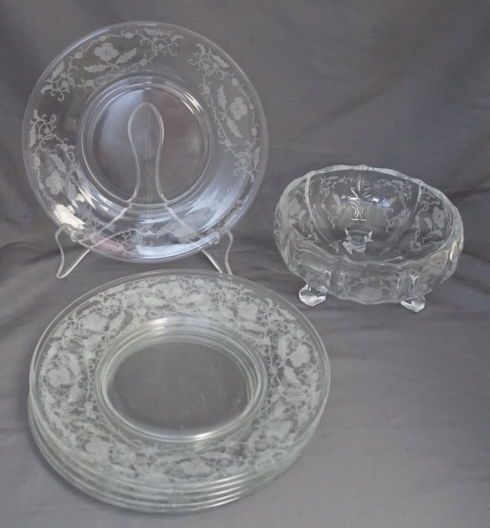 7 PC FOSTORIA SHIRLEY DESSERT PLATES & CANDY BOWL: SIx (6) Vintage c. 1938 Fostoria Etched "Shirley" Etched Glass Salad / Dessert Plates 7 1/2" and 1 Footed Bon Bon Bowl 7'. Weight on all 4 pds 11 oz. PROVENANCE: A Private Charleston SC Estate