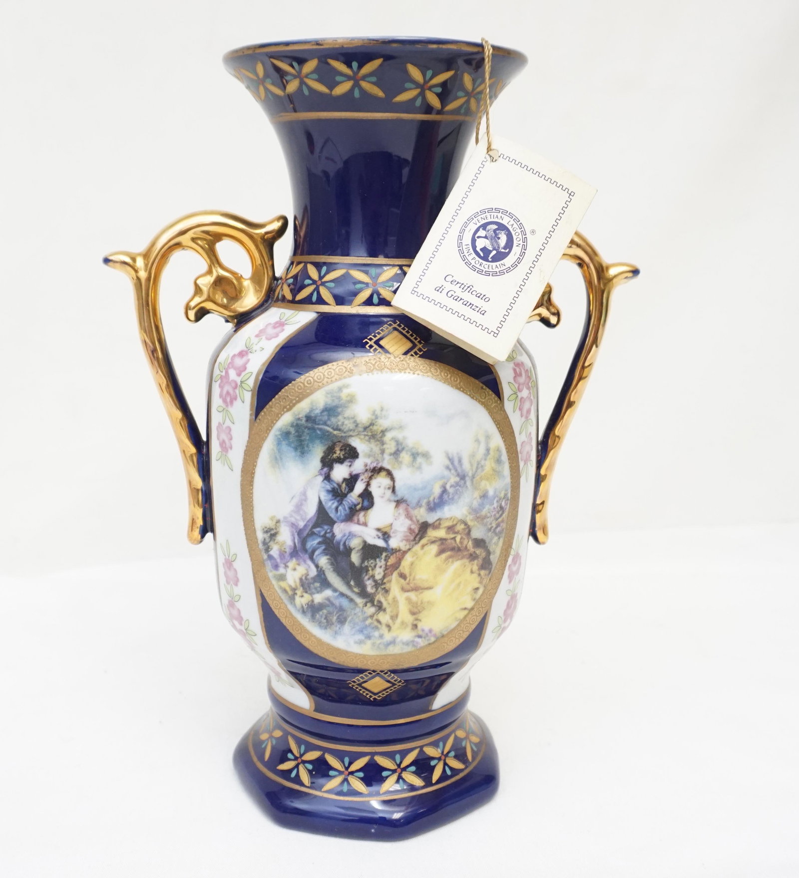 VENETIAN LAGOON LIMOGES PORCELAIN VASE: Venetian Lagoon Fine Porcelain Limoges Vase. Cobalt with romantic transfer and hand painted gilt and enamel accents. Measures 10" tall. Weight 1 pd 9 oz. PROVENANCE: A Private Charleston SC Estate.