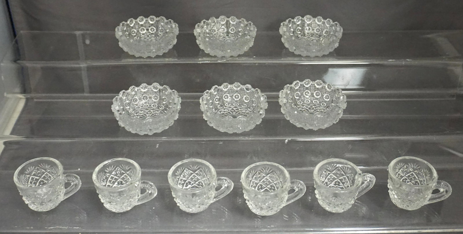 12 EAPG GLASS SALT CELLARS: 12 Eapg Glass Salt Cellars. 6 at 2 1/4" wide. 6 Miniature Cups at 1 1/4" tall. Weight on all 1 pd 4 oz. PROVENANCE: A Private Charleston SC Estate.