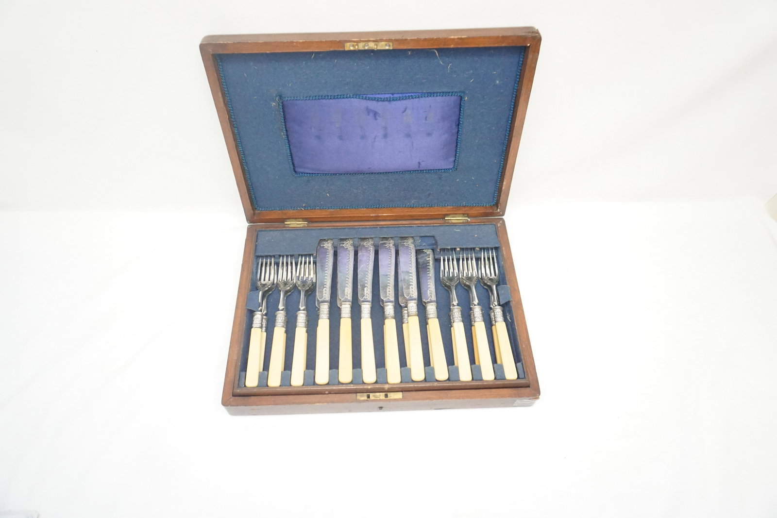 JAMES DIXON & SONS SILVER PLATED FISH SERVICE: Antique c. 1879 English James Dixon & Son Silver Plated Fish Service for 12. Bone Handles, Etched Design. In the original mahogany presentation box. Box measures 14 1/2"x10 1/2"x2 1/2". Weight 5 pds 1
