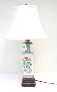 CHINESE FAMILLE ROSE TABLE LAMP: Chinese Famille Rose antique hand painted porcelain vase, mounted as table lamp, floral decoration, 15" to top of socket. On carved wood 2 tier stand. Lamp is 21" to top of finial Shade 11"x11"x8 1/2"