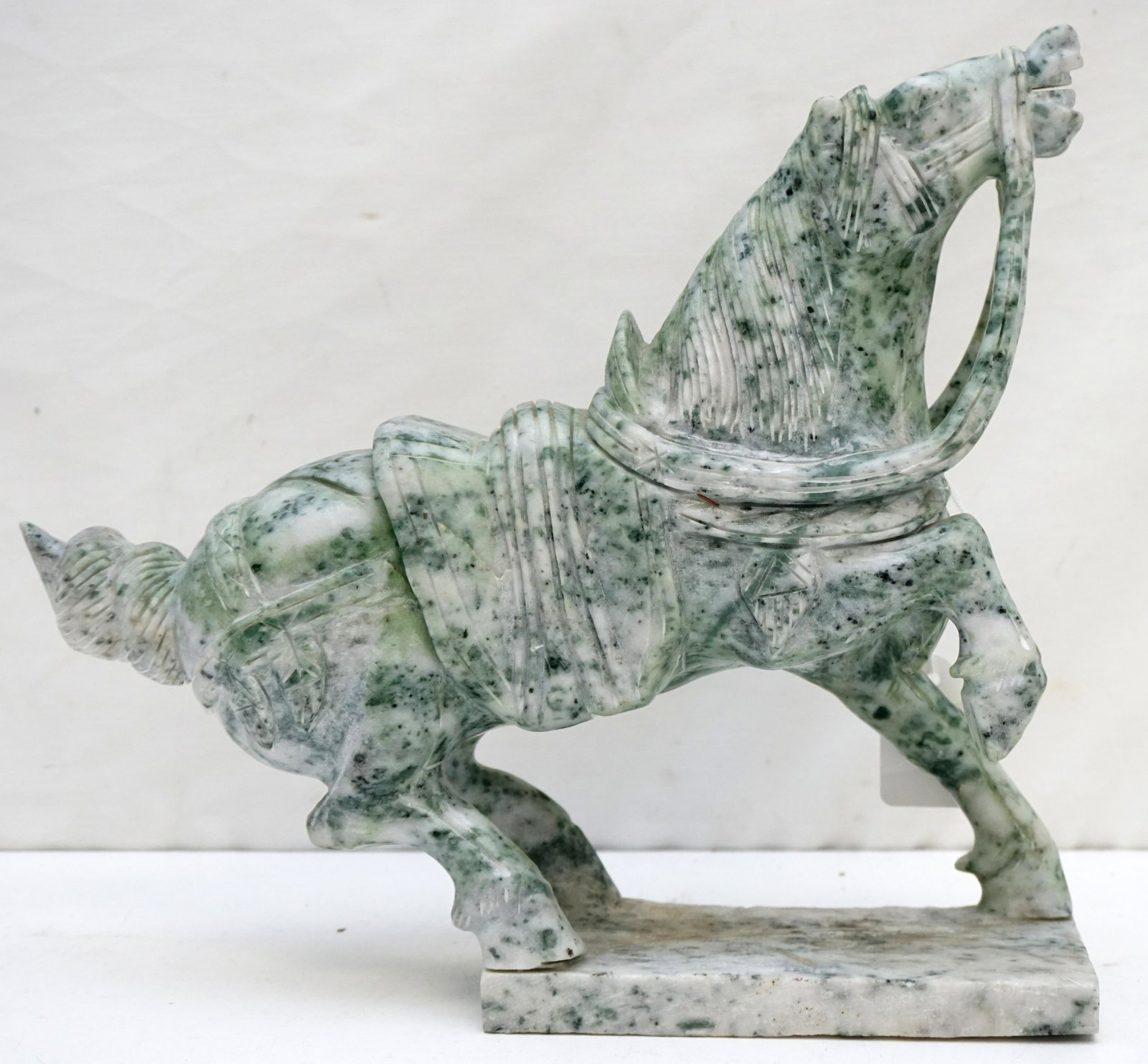 HAND CARVED SPINACH JADEITE HORSE: Hand carved Large Chinese Spinach Jadeite Horse with full saddle and reins. No chips or cracks. Measures 12"x3 1/4"x11". Weight 11 pds.